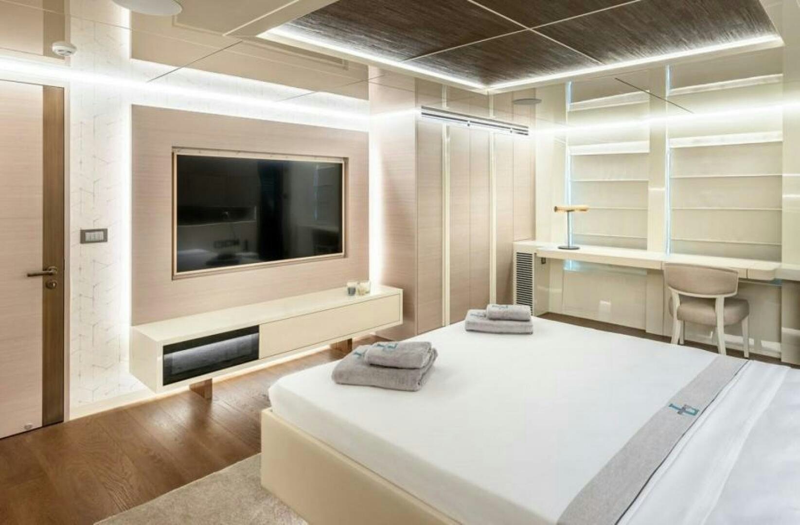 a room with a large flat screen television and a table aboard NUMARINE 32XP HULL 6 Yacht for Sale