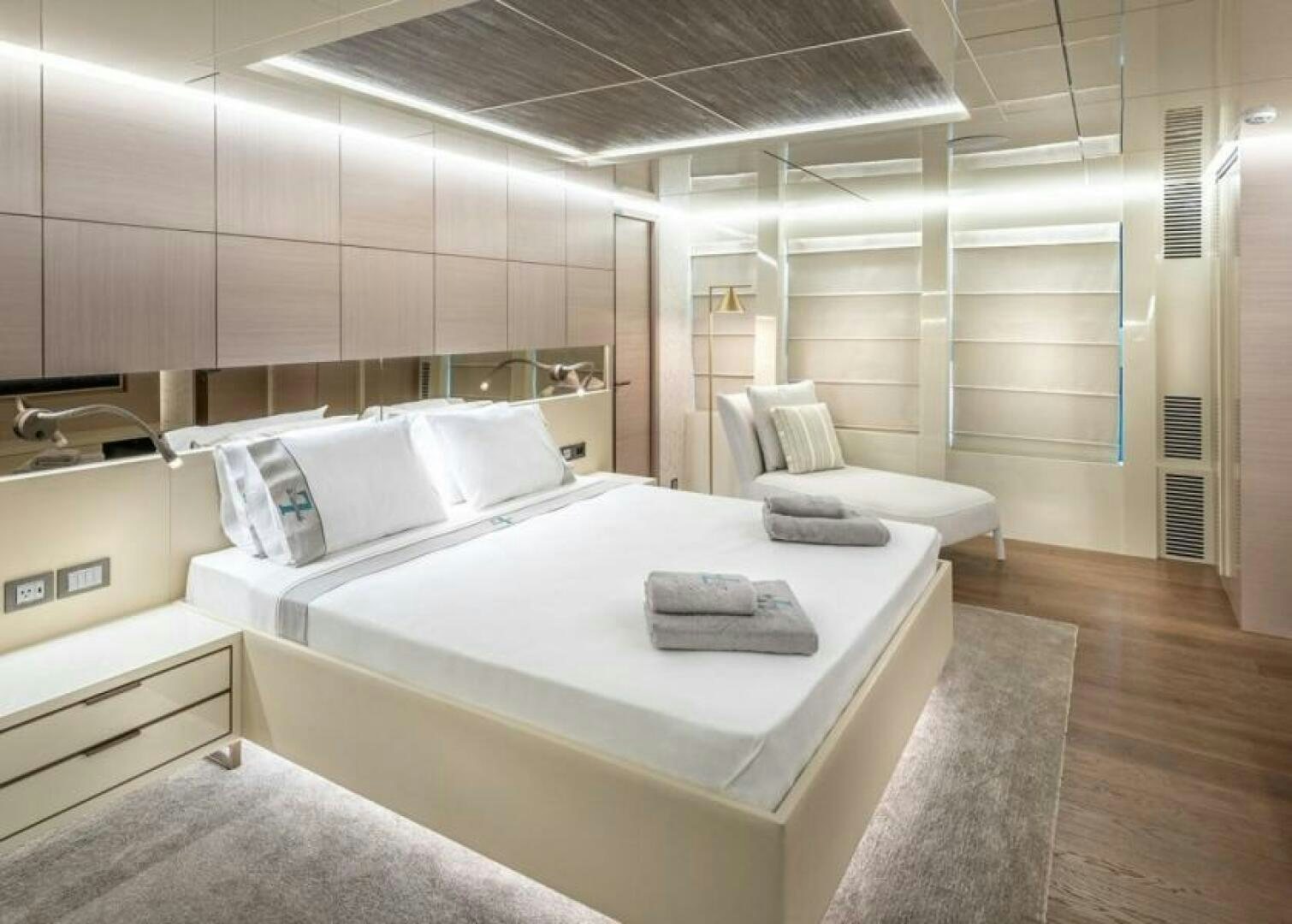 a room with a bed and a couch aboard NUMARINE 32XP HULL 6 Yacht for Sale