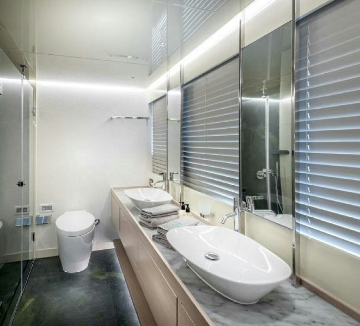 a bathroom with a sink and a mirror aboard NUMARINE 32XP HULL 6 Yacht for Sale