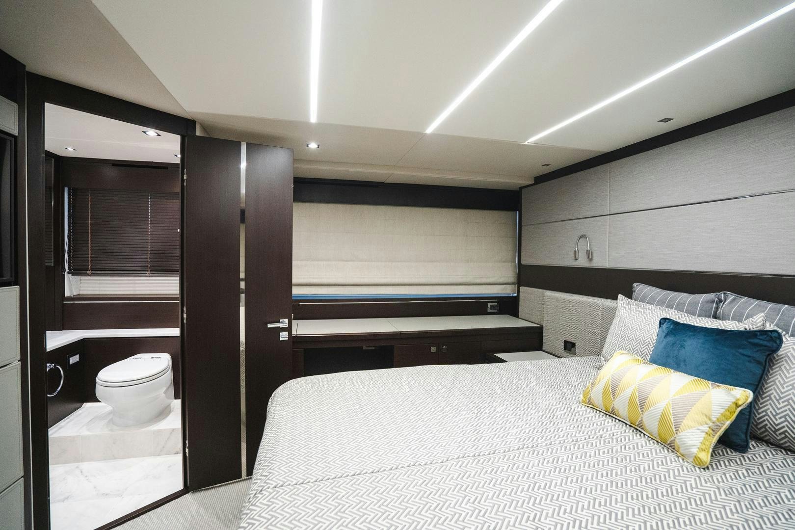a room with a bed and a closet aboard INCENTIVIZED Yacht for Sale