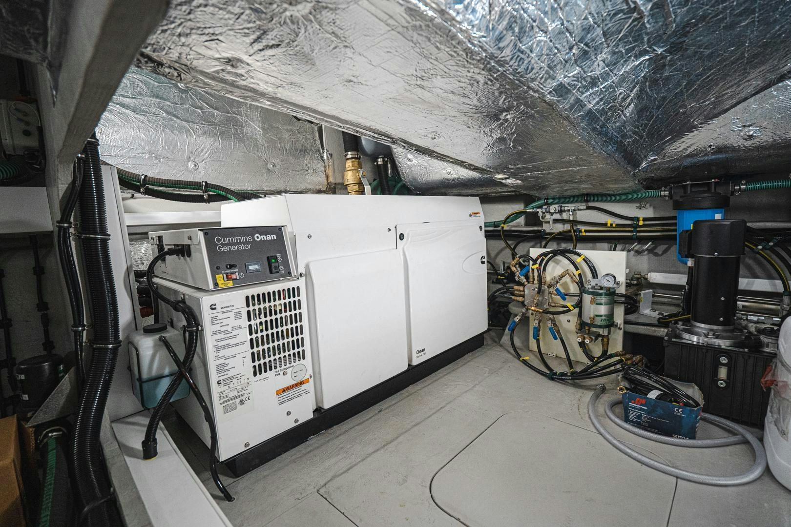 a large white machine with wires aboard INCENTIVIZED Yacht for Sale