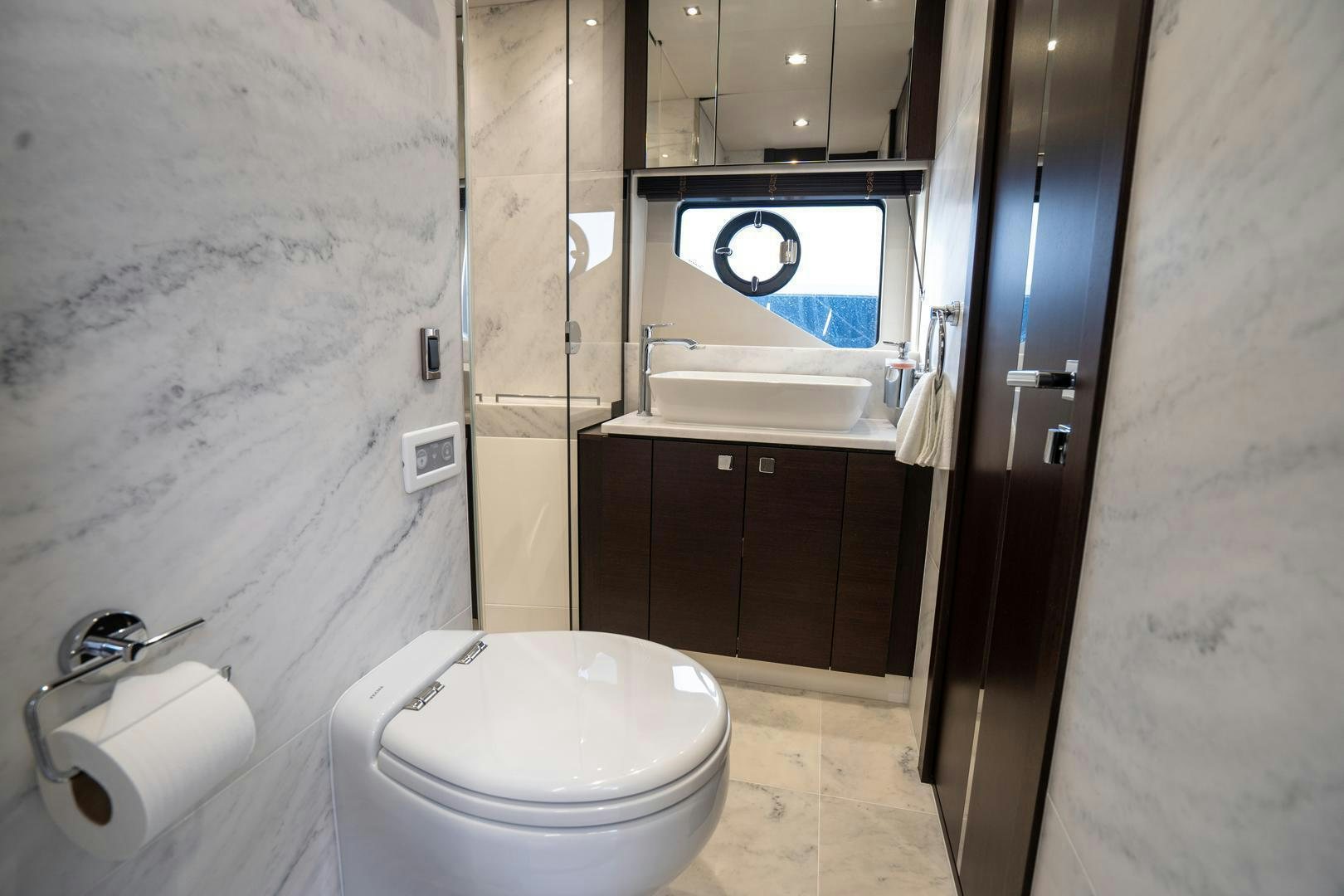 a bathroom with a toilet and a sink aboard INCENTIVIZED Yacht for Sale