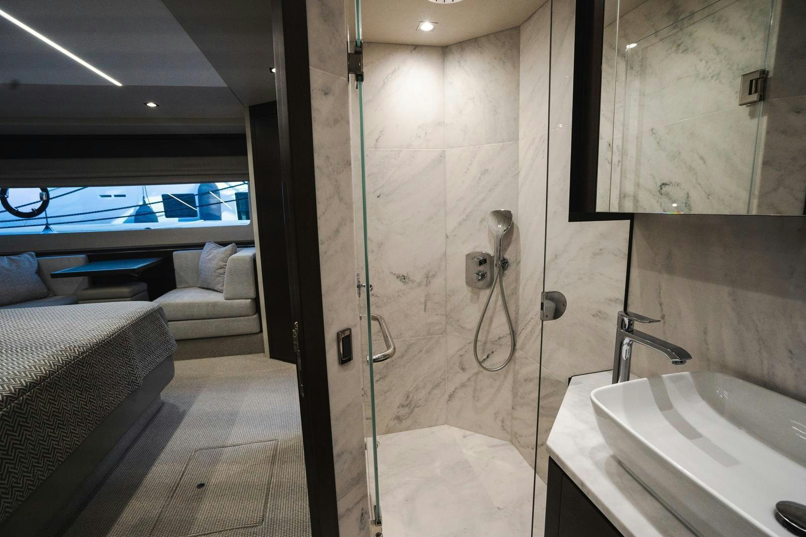 a bathroom with a glass shower aboard INCENTIVIZED Yacht for Sale