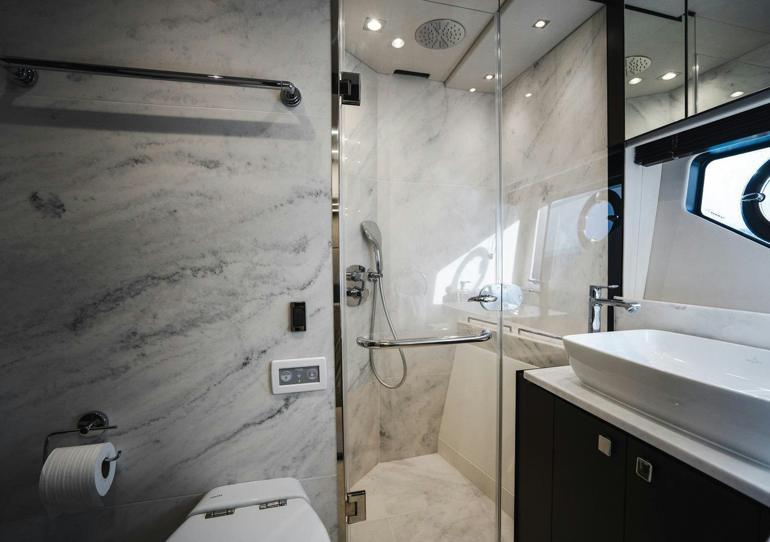 a bathroom with a shower and sink aboard INCENTIVIZED Yacht for Sale