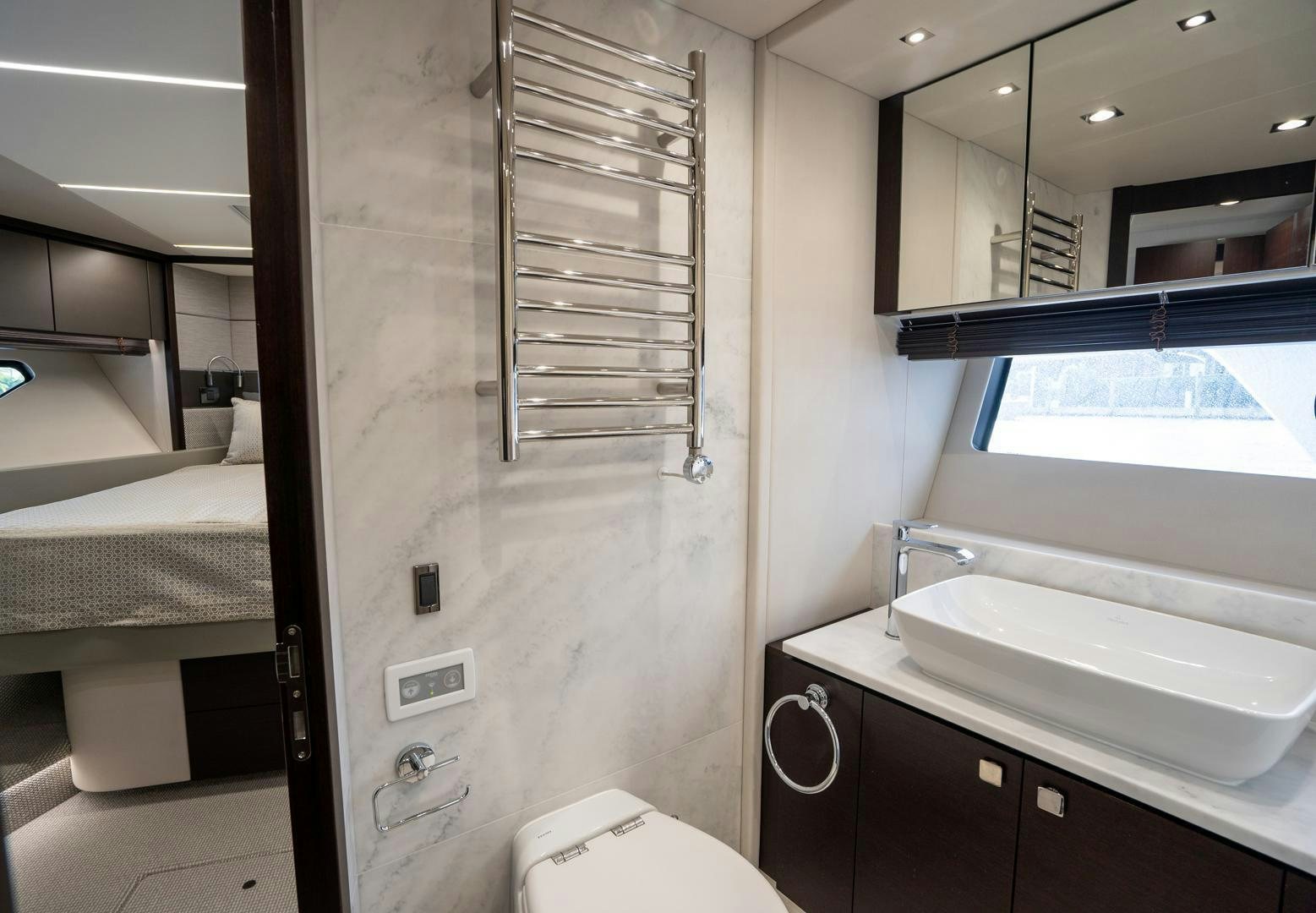 a bathroom with a sink and a mirror aboard INCENTIVIZED Yacht for Sale