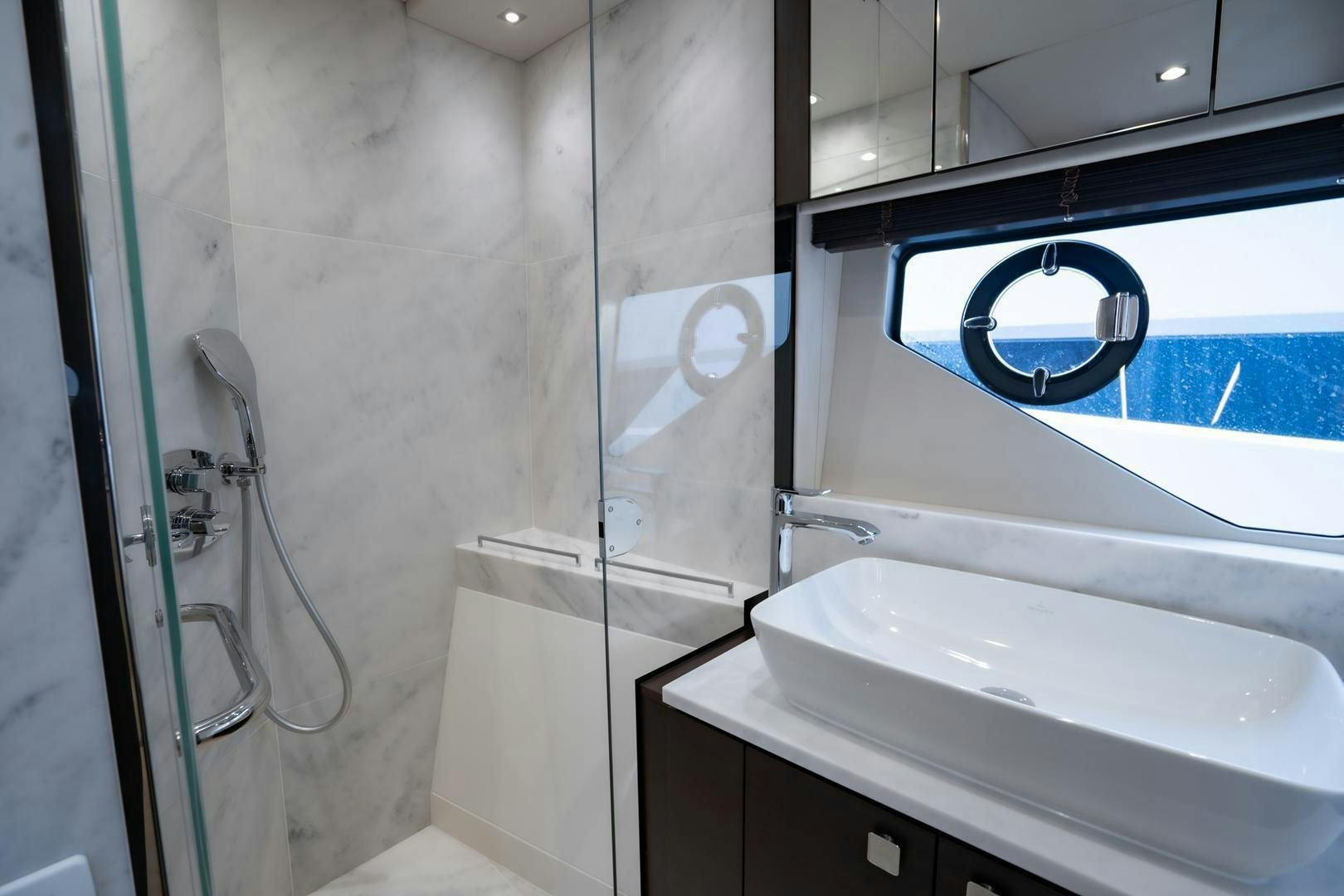 a bathroom with a sink and a shower aboard INCENTIVIZED Yacht for Sale