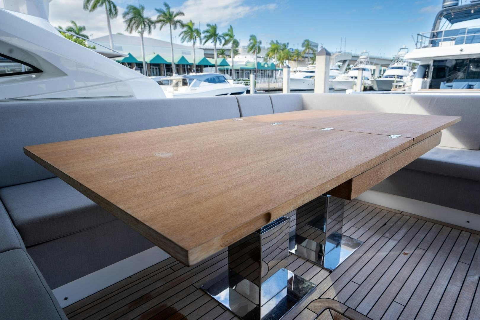 a wood table on a deck aboard INCENTIVIZED Yacht for Sale