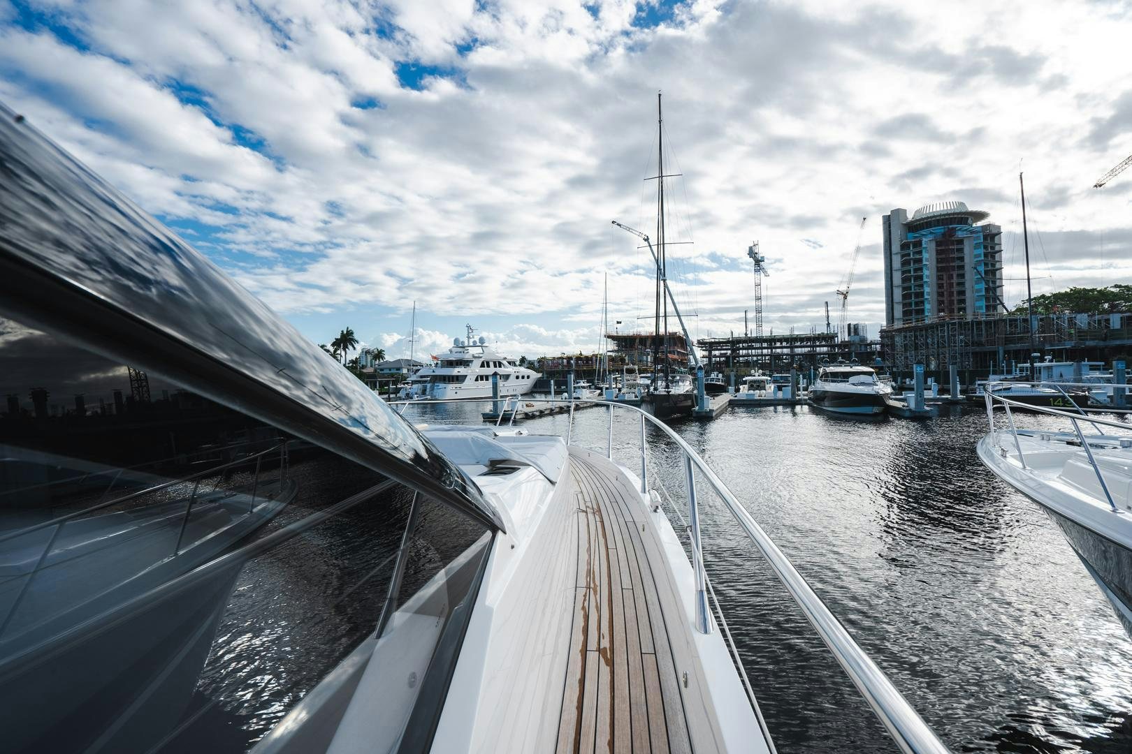 a view of a canal with boats and buildings in the background aboard INCENTIVIZED Yacht for Sale