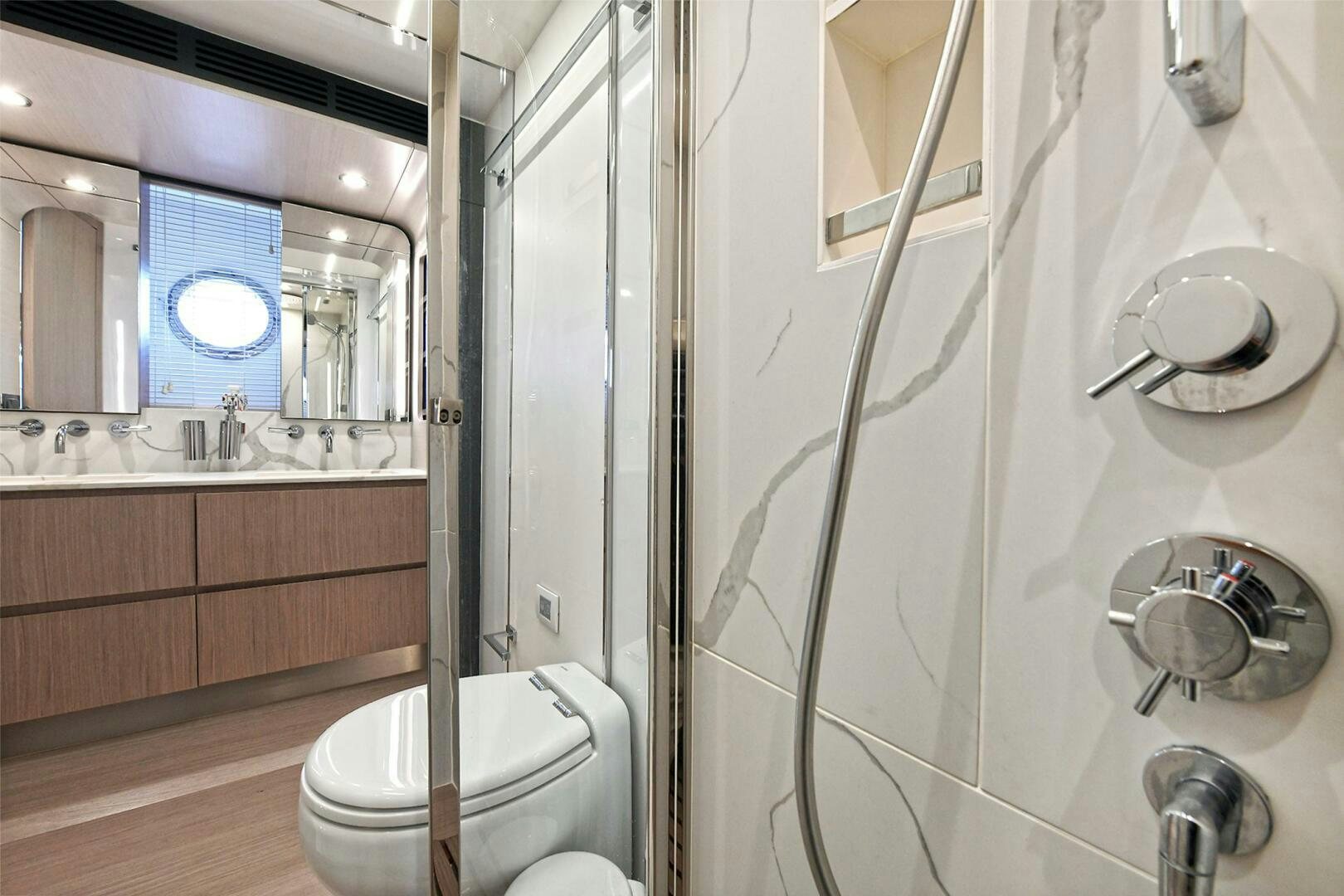 a bathroom with a glass shower aboard SLAINTE Yacht for Sale