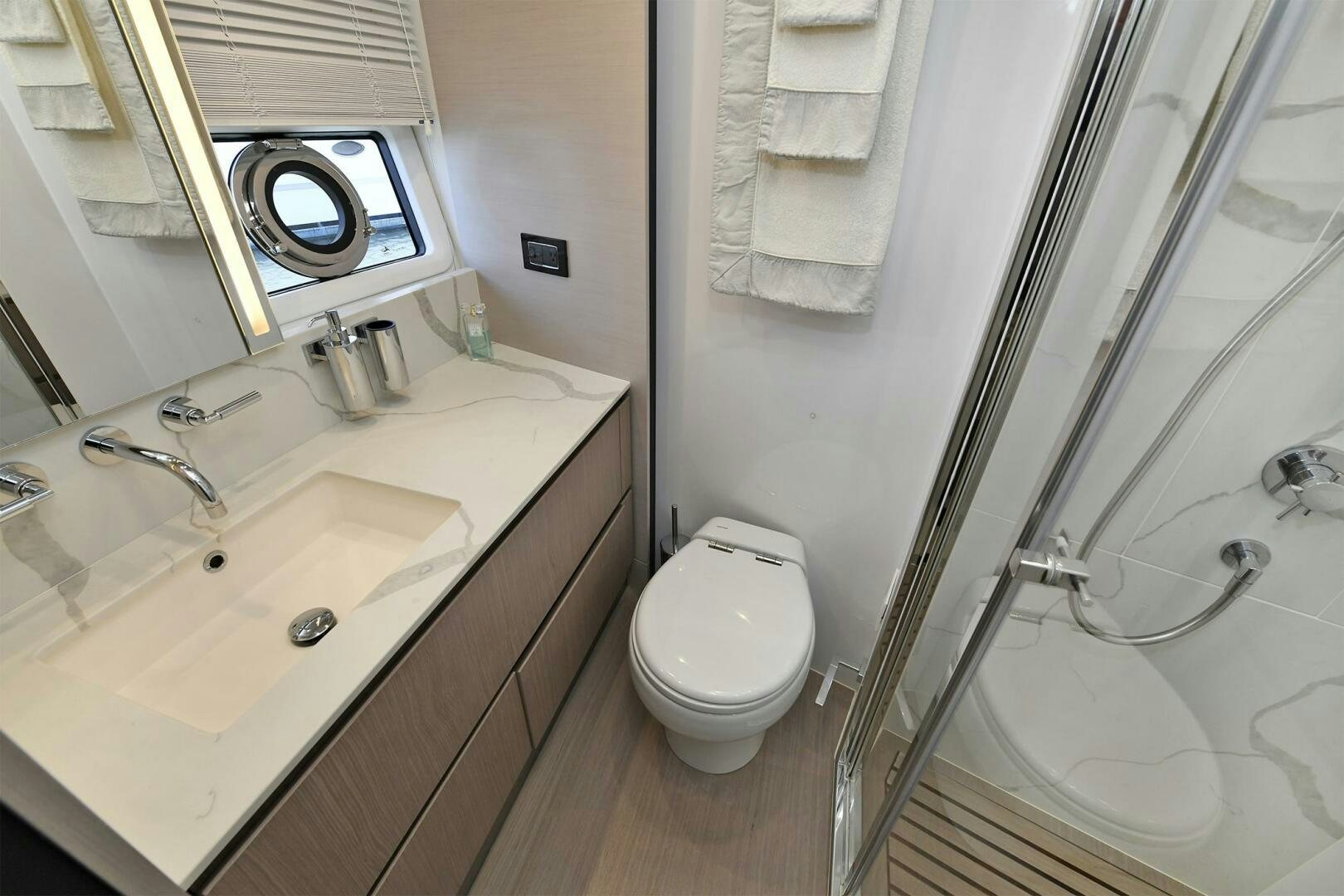 a bathroom with a sink and a toilet aboard SLAINTE Yacht for Sale