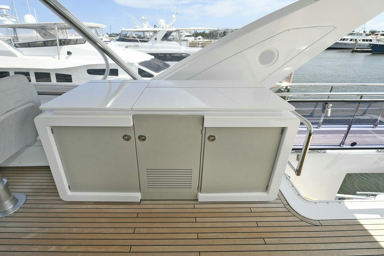 a white boat on a dock aboard SLAINTE Yacht for Sale