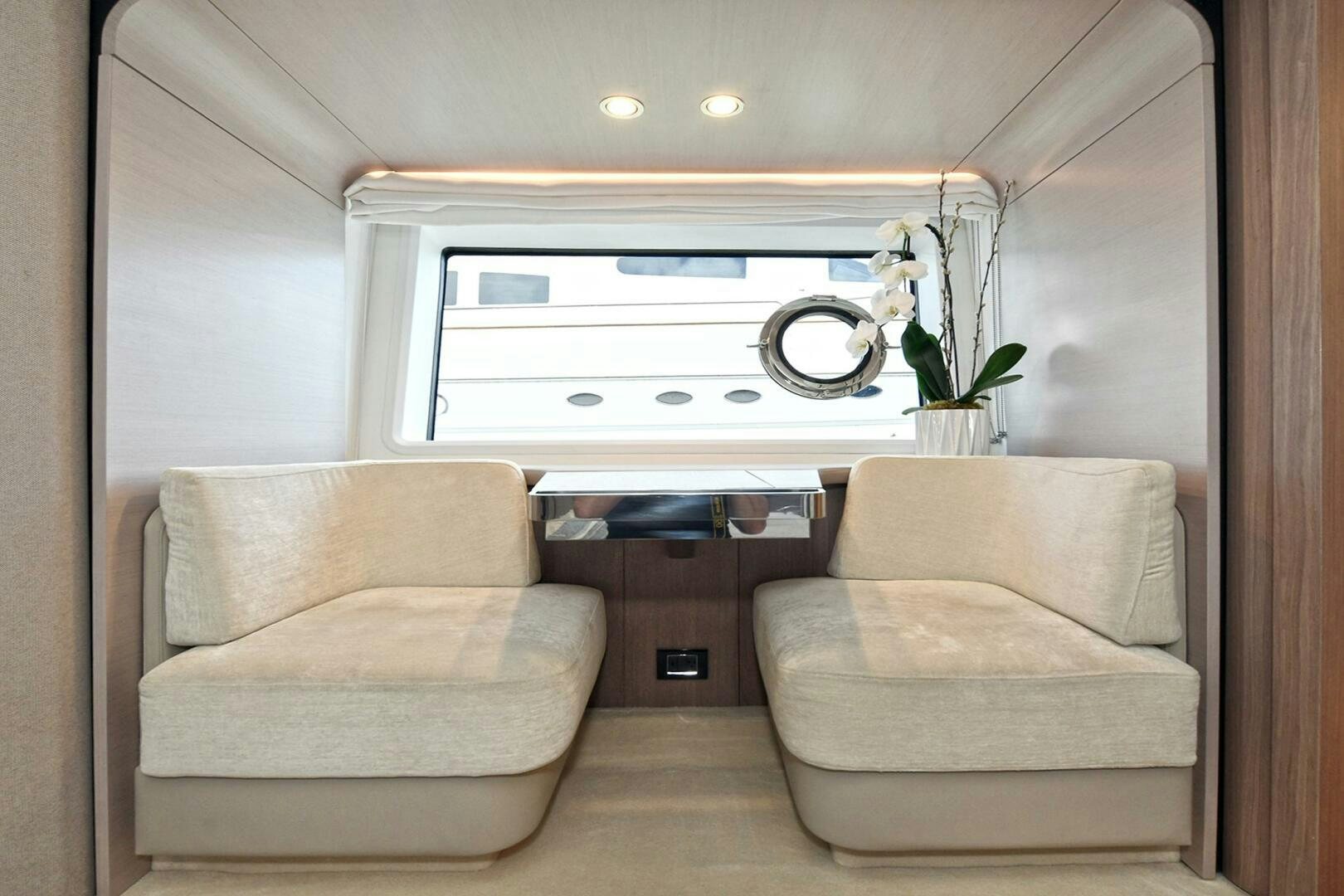 a room with couches and a fan aboard SLAINTE Yacht for Sale