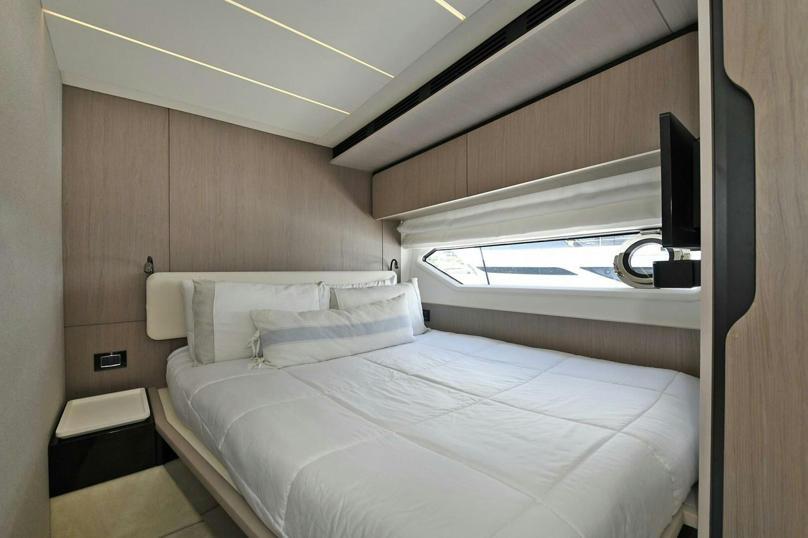 a bedroom with a bed aboard SLAINTE Yacht for Sale