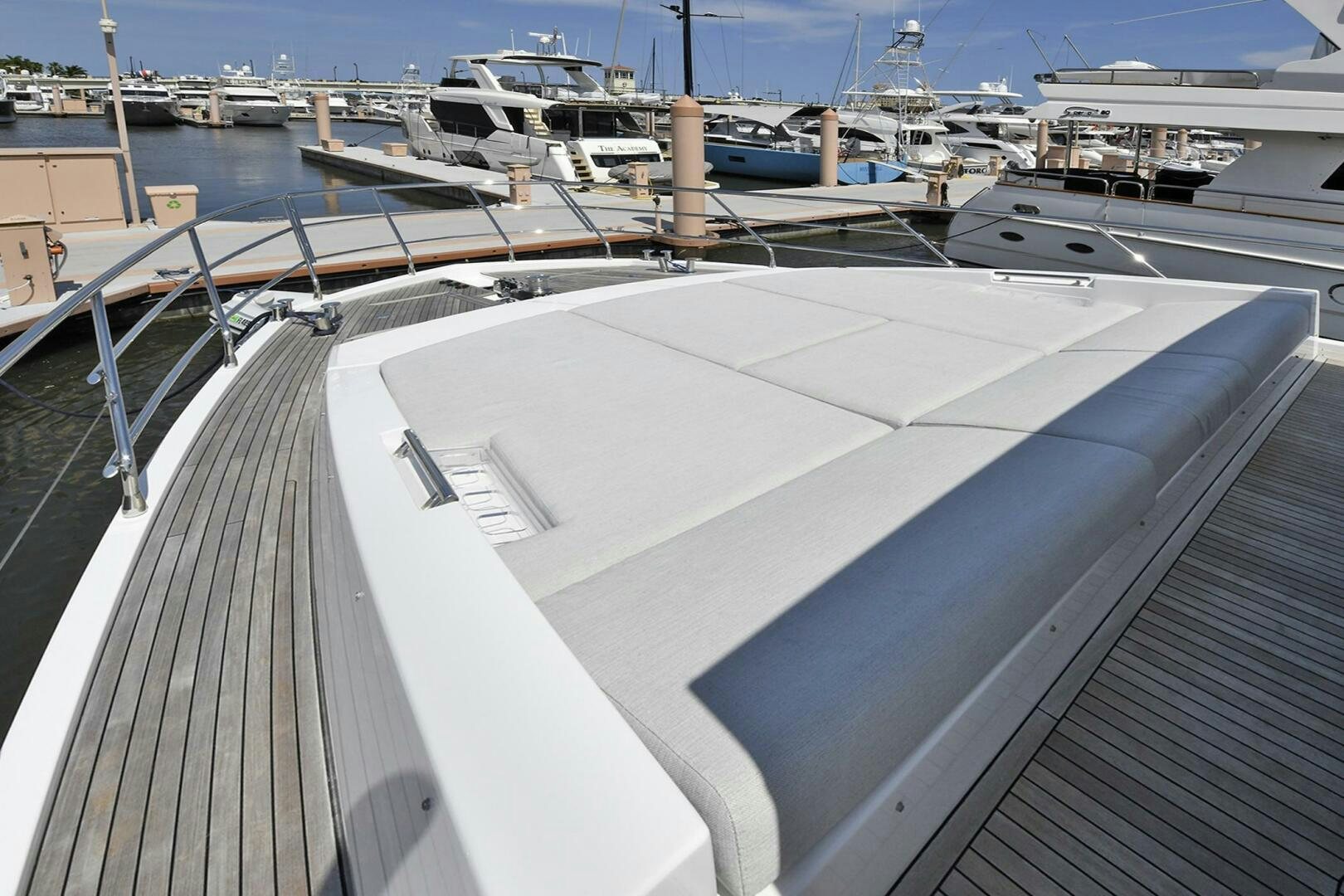 a deck with a boat in the water aboard SLAINTE Yacht for Sale