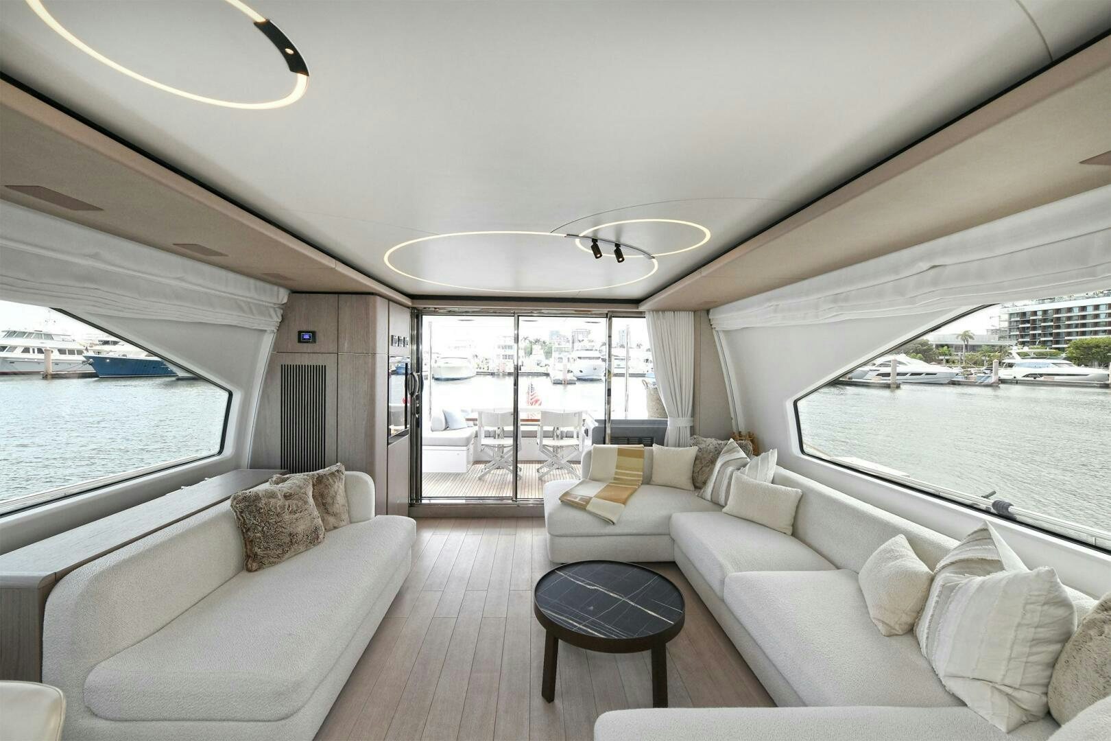 a living room with a large window aboard SLAINTE Yacht for Sale