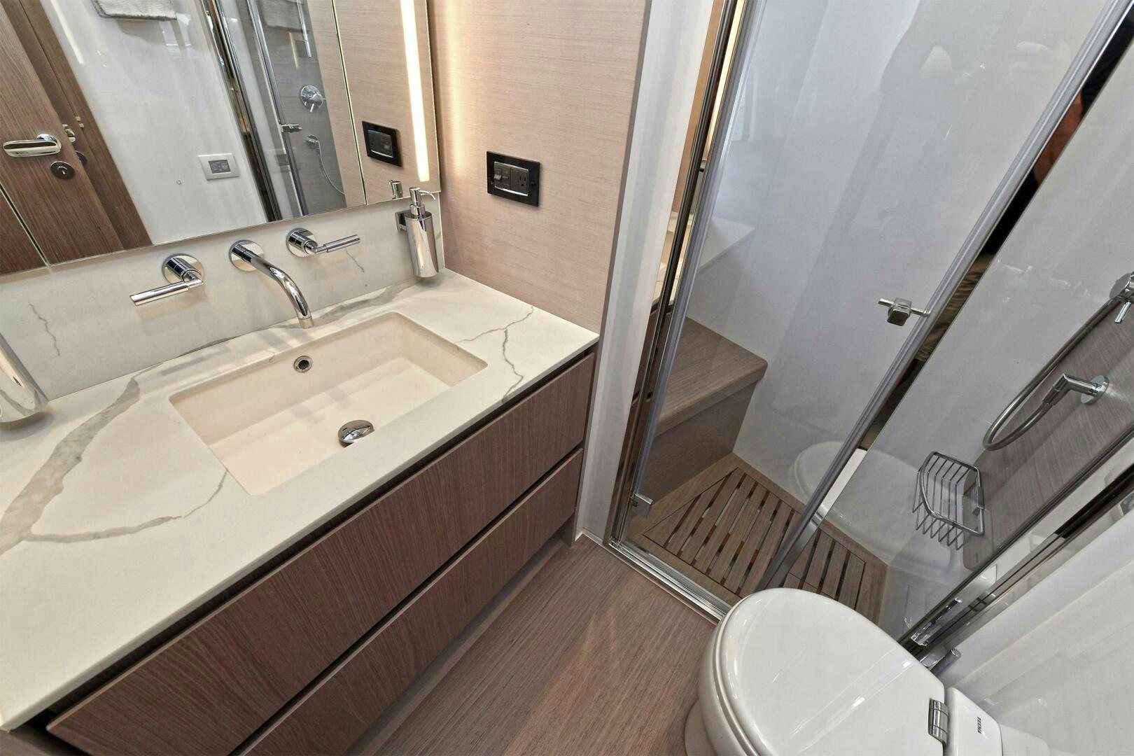 a bathroom with a glass shower door aboard SLAINTE Yacht for Sale