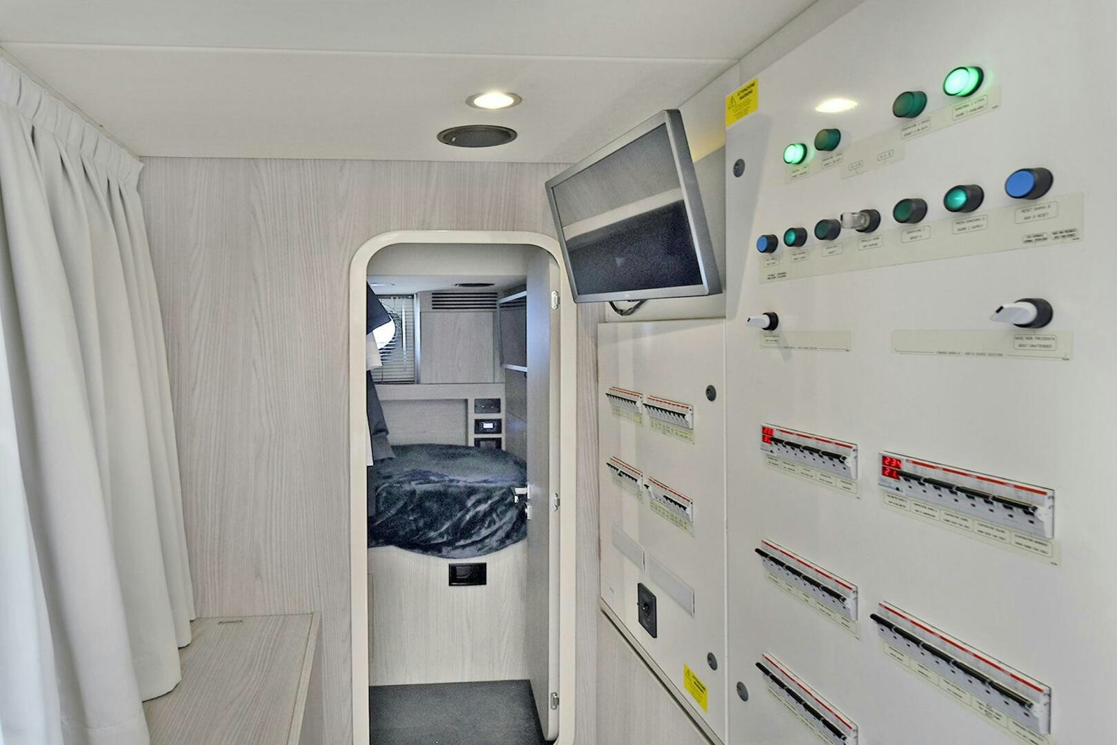 a room with a bed and a desk aboard SLAINTE Yacht for Sale