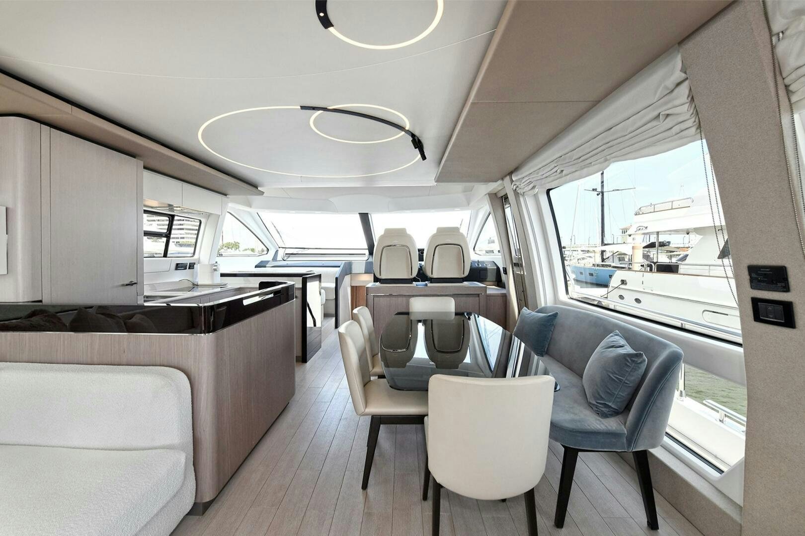 a room with a table chairs and a window aboard SLAINTE Yacht for Sale