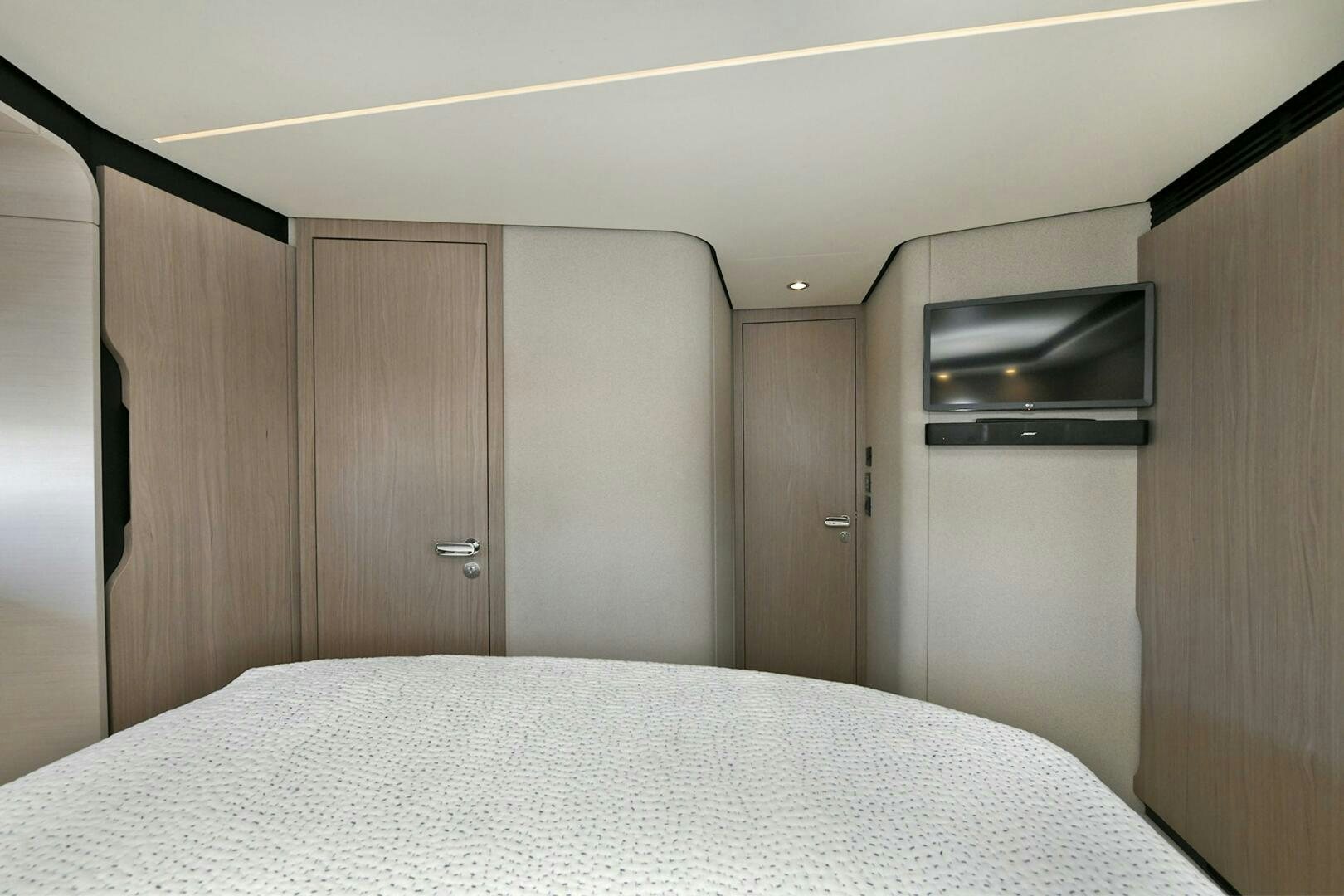 a bed in a room aboard SLAINTE Yacht for Sale