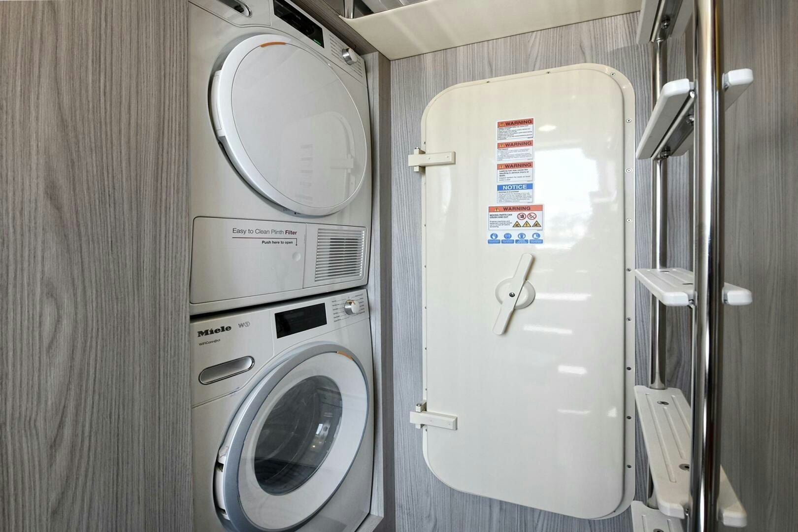 a washer and dryer in a room aboard SLAINTE Yacht for Sale