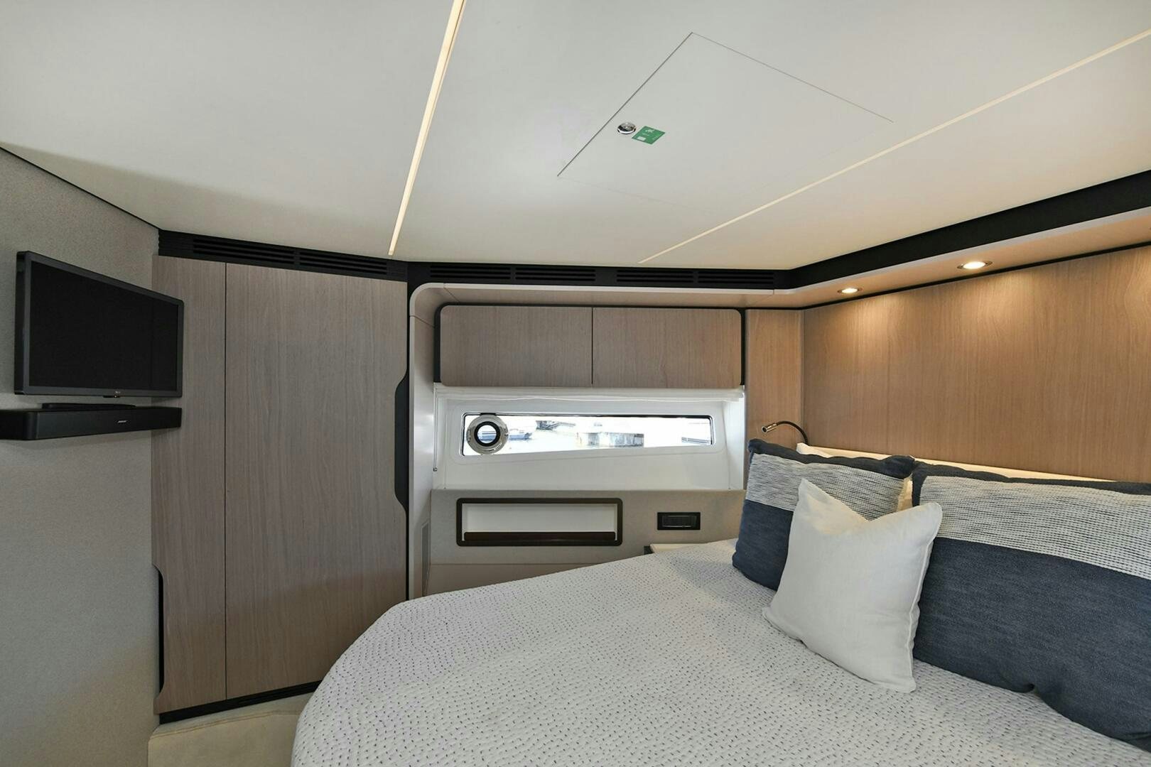a bed with a television and a bed aboard SLAINTE Yacht for Sale