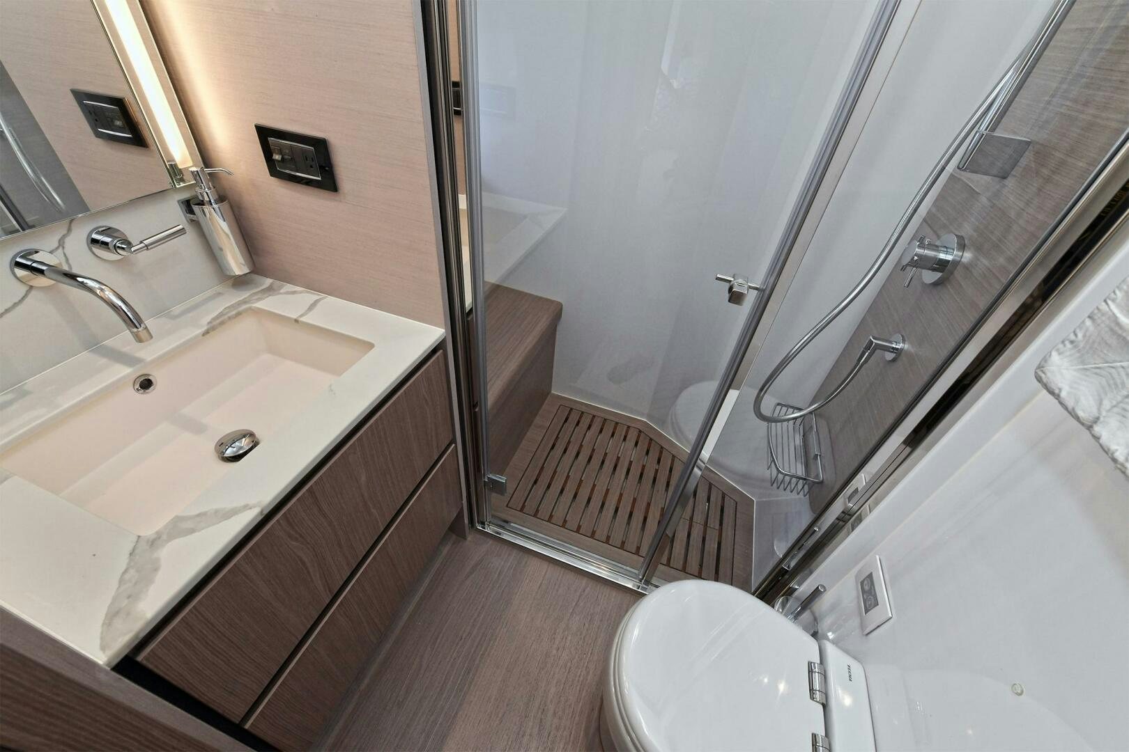 a bathroom with a shower and sink aboard SLAINTE Yacht for Sale