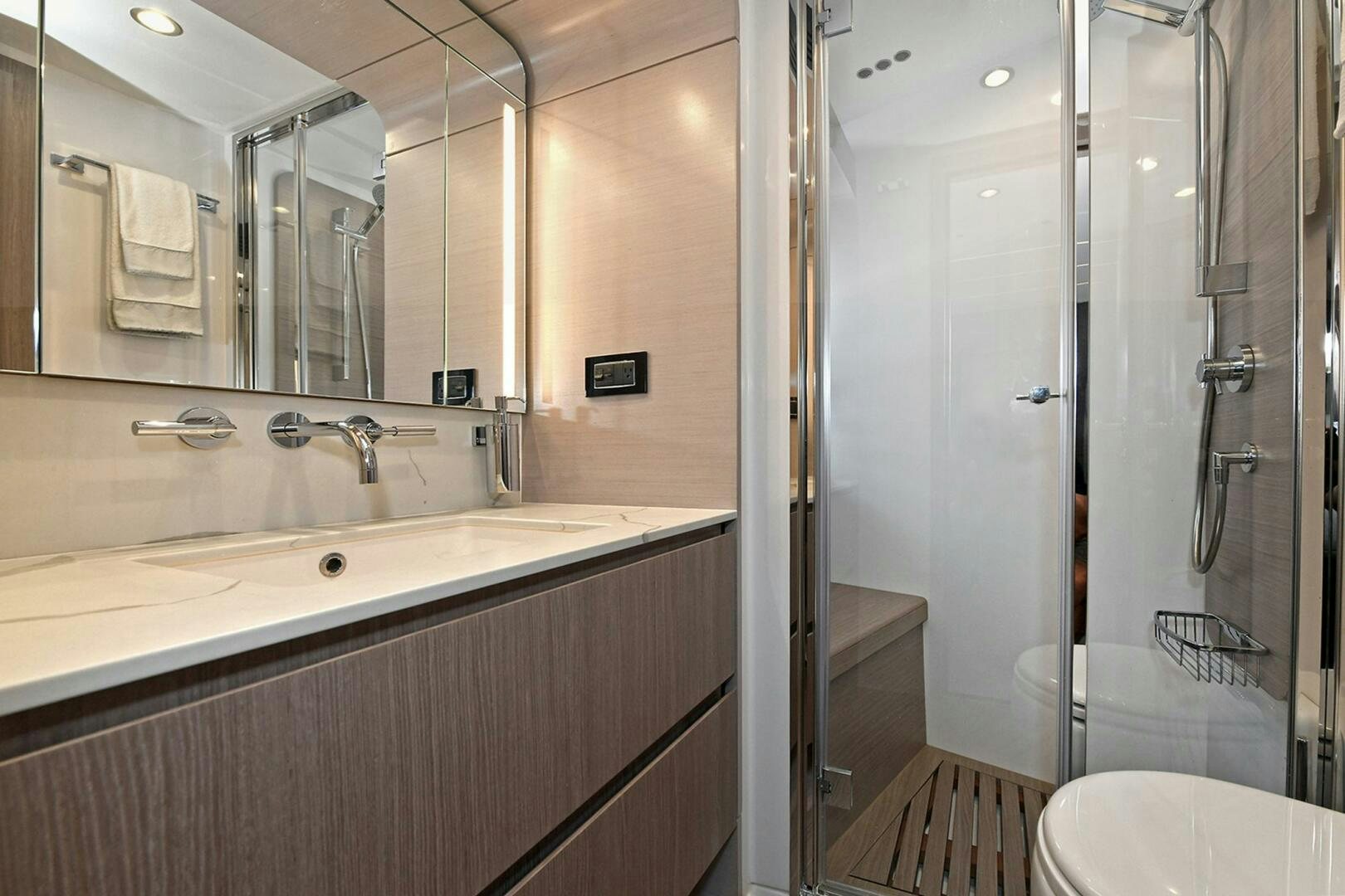 a bathroom with a glass shower aboard SLAINTE Yacht for Sale
