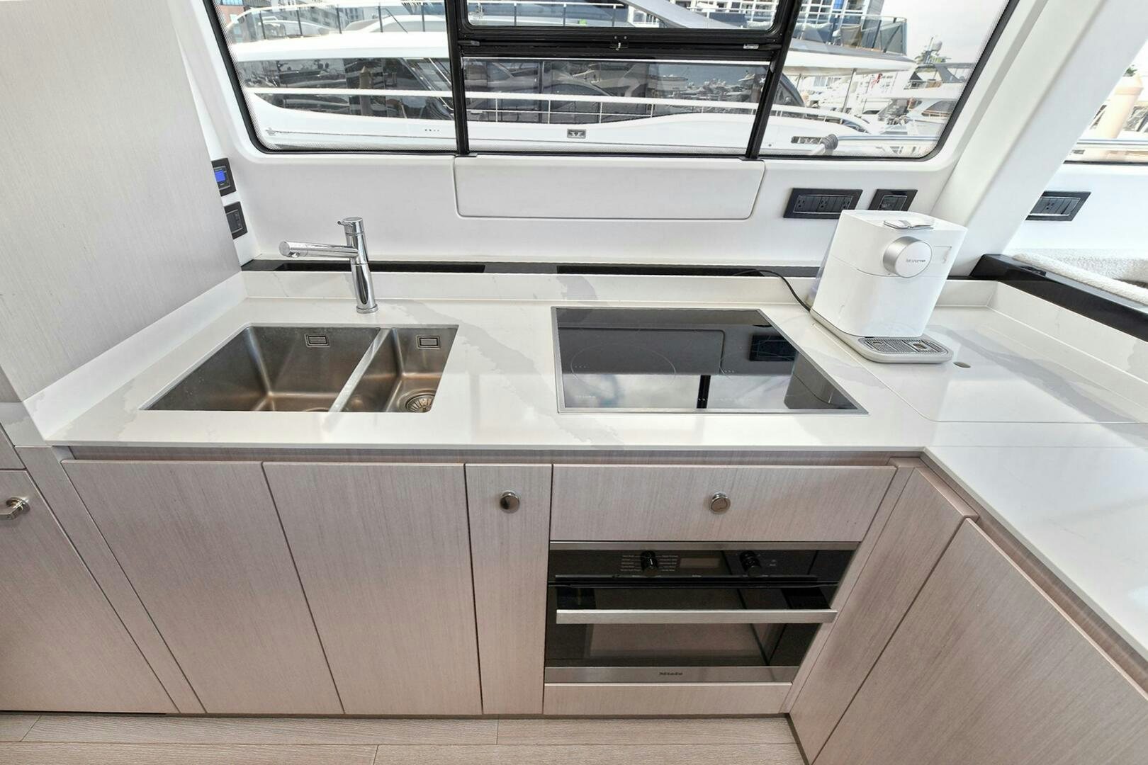 a kitchen with a sink and a stove aboard SLAINTE Yacht for Sale