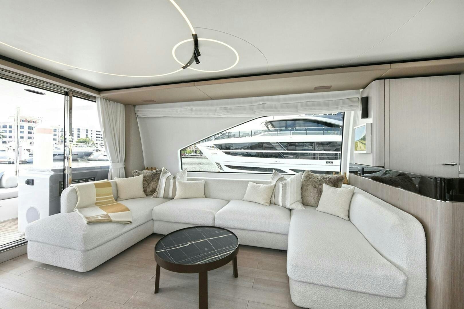a living room with a large window aboard SLAINTE Yacht for Sale