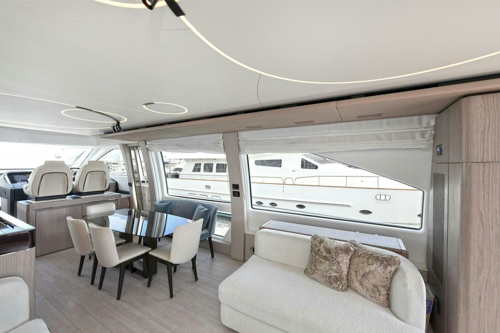 a room with a couch and a table and chairs aboard SLAINTE Yacht for Sale