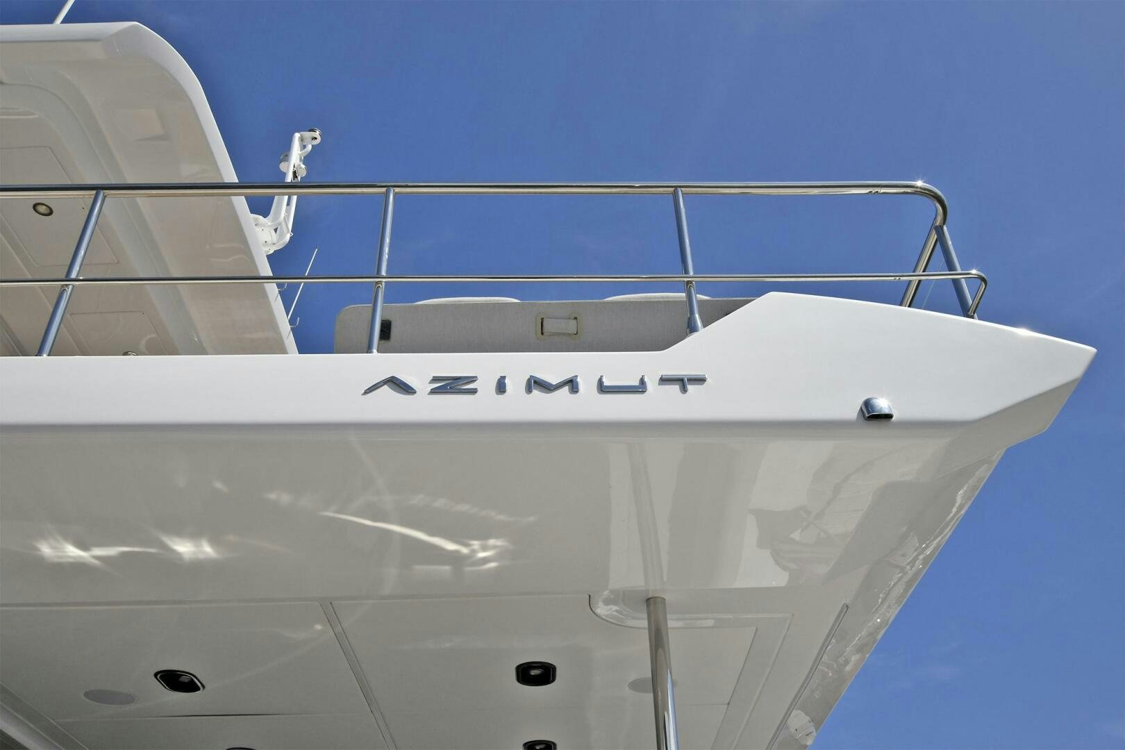a white boat with black text aboard SLAINTE Yacht for Sale