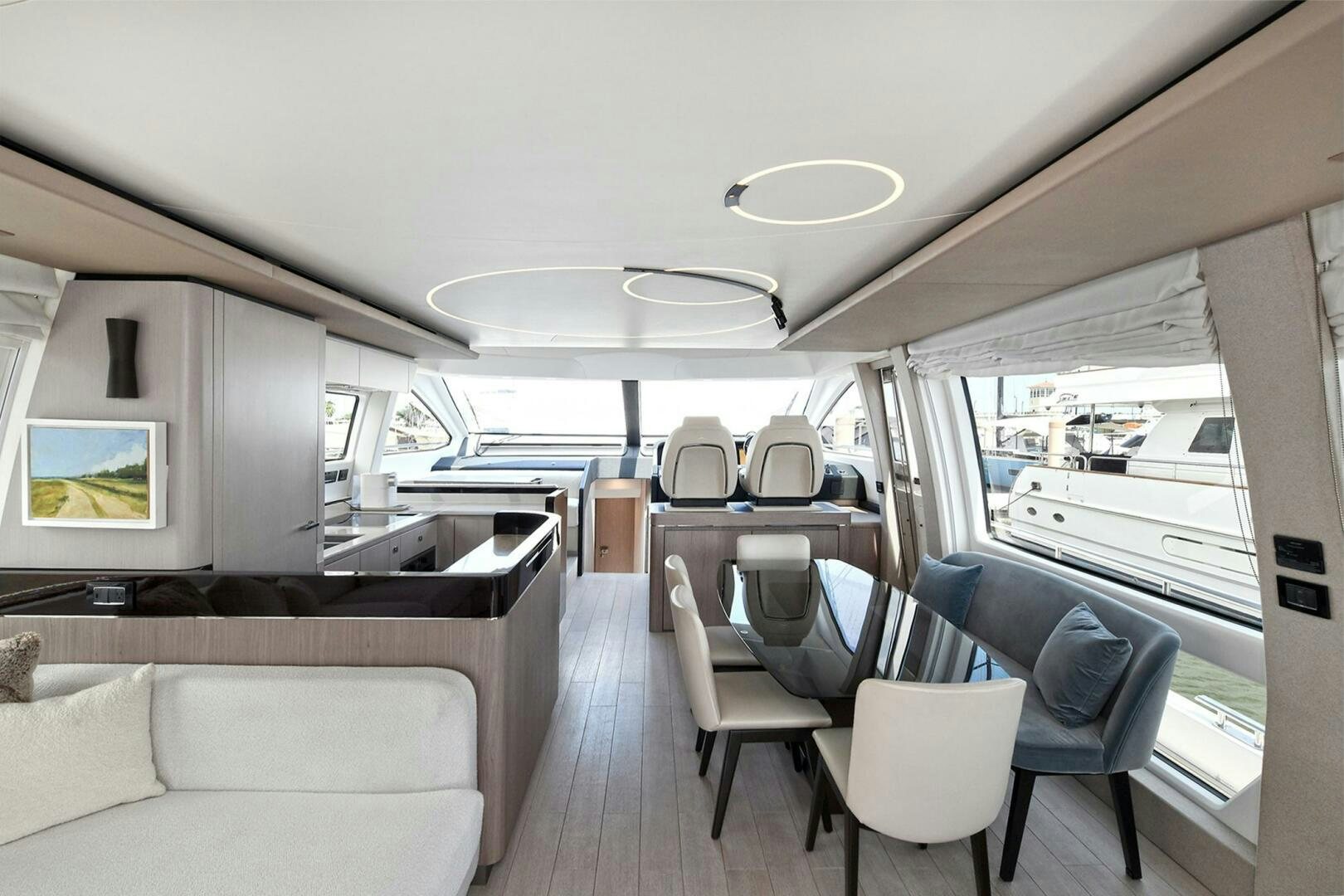 a room with a couch and a table and chairs aboard SLAINTE Yacht for Sale