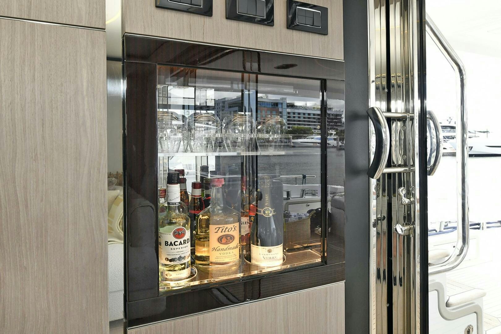 a group of bottles on a shelf aboard SLAINTE Yacht for Sale