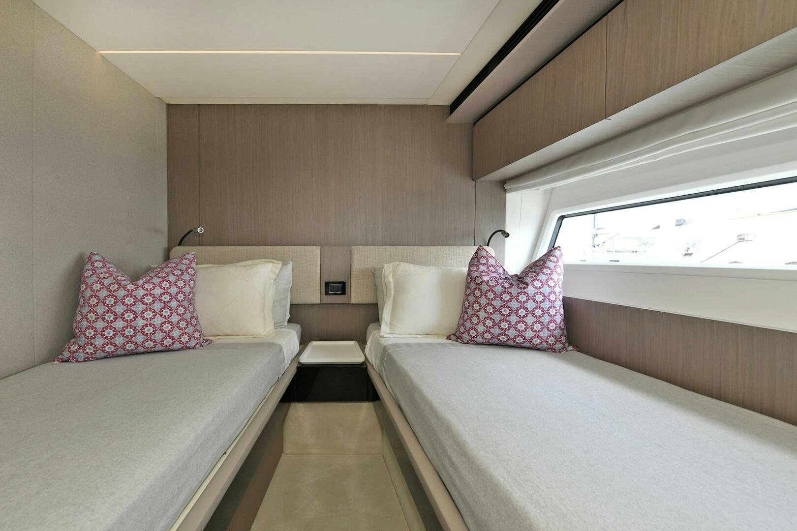 a couple of beds in a room aboard SLAINTE Yacht for Sale