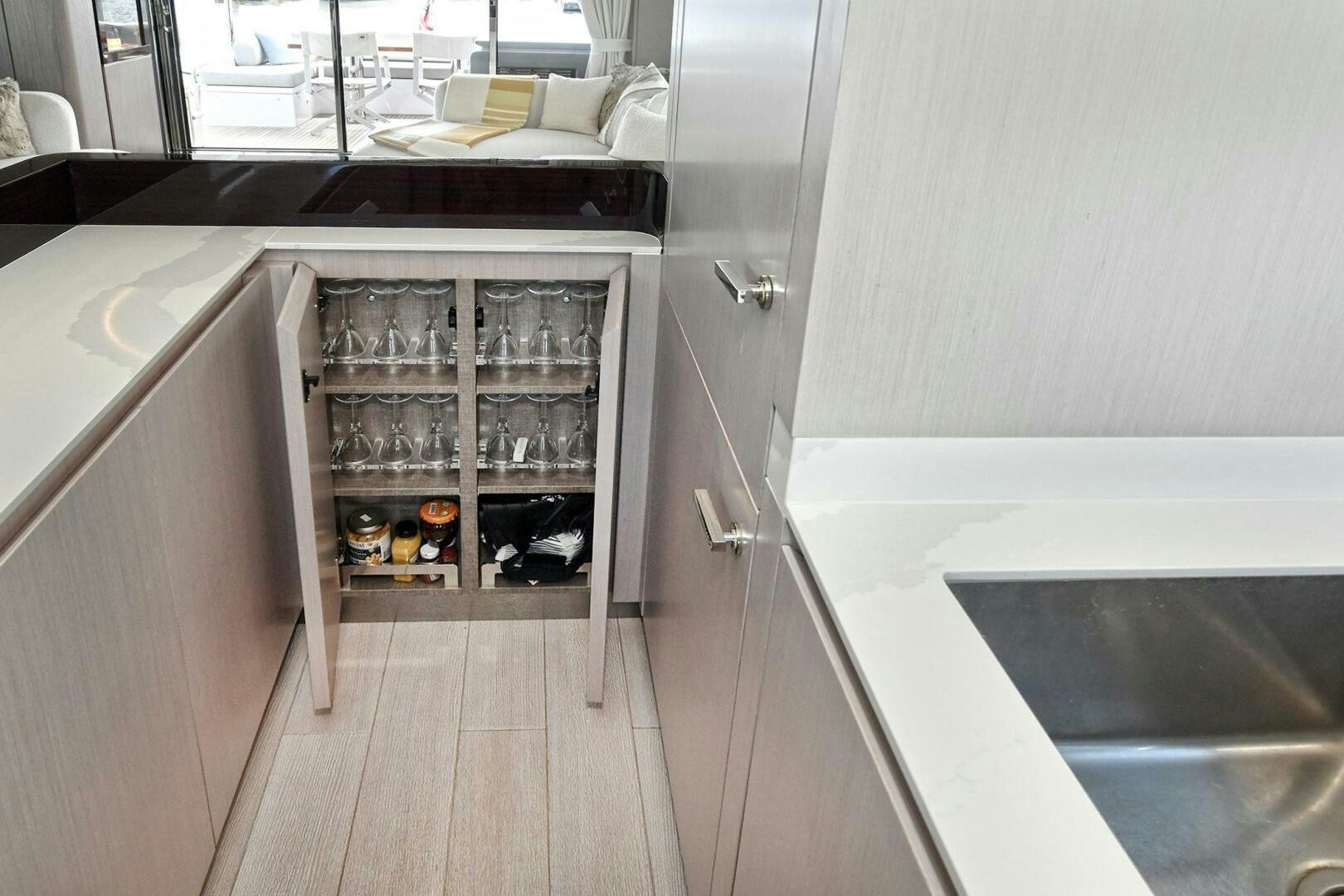 a kitchen with a lot of cupboards and shelves aboard SLAINTE Yacht for Sale