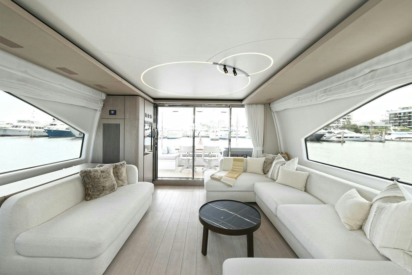 a living room with a large window aboard SLAINTE Yacht for Sale