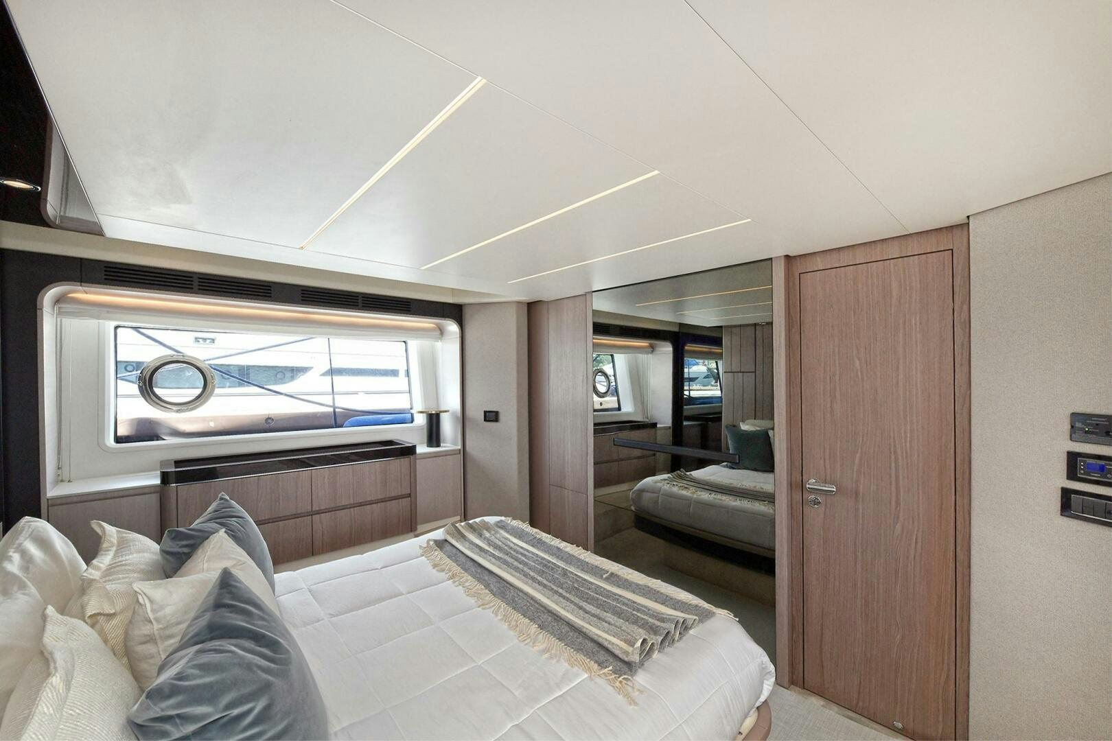 a room with a bed and a television aboard SLAINTE Yacht for Sale