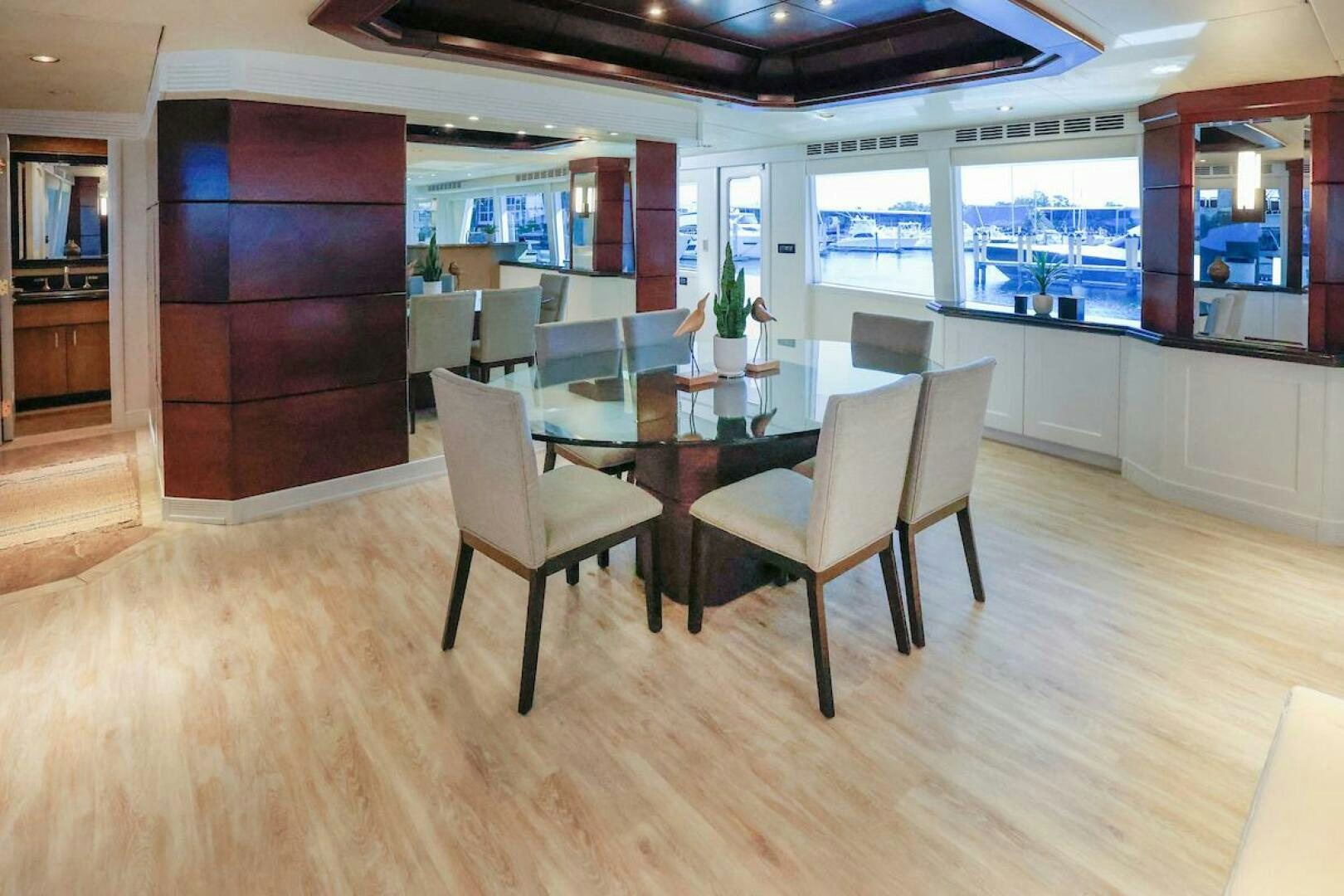a room with a table and chairs aboard NORTH COAST Yacht for Sale