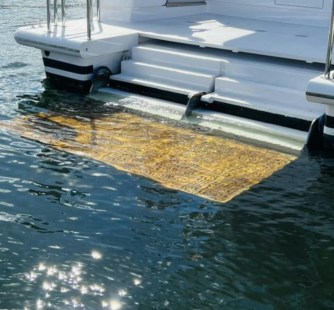 a couple of boats sit in a harbor aboard NORTH COAST Yacht for Sale