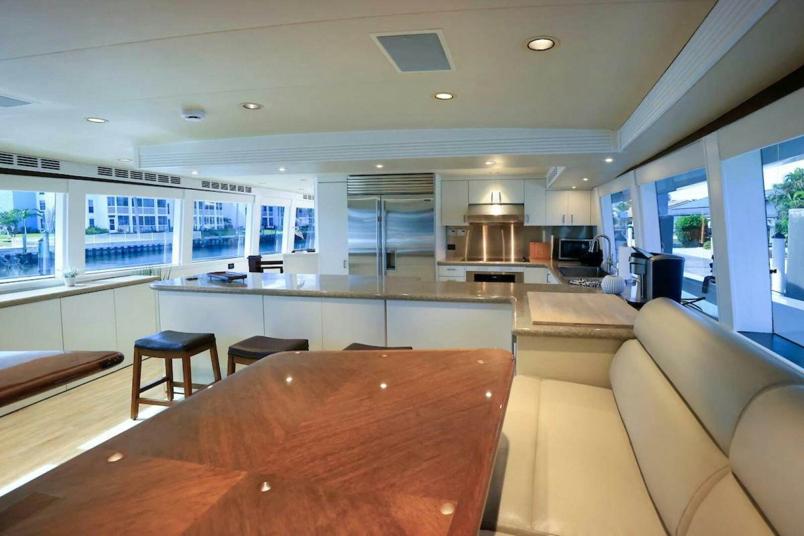 a large kitchen with a table aboard NORTH COAST Yacht for Sale