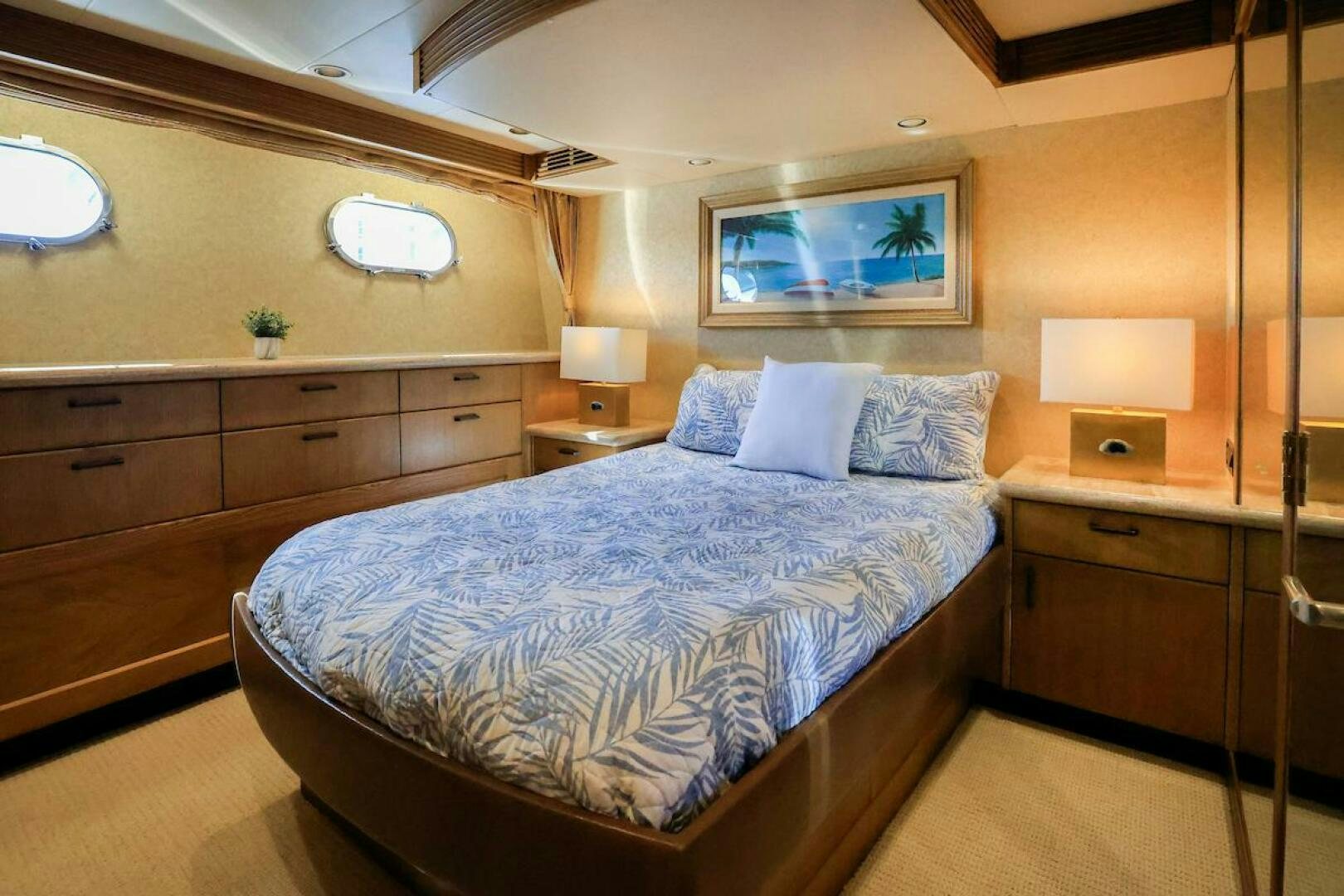 a bedroom with a bed and a desk aboard NORTH COAST Yacht for Sale