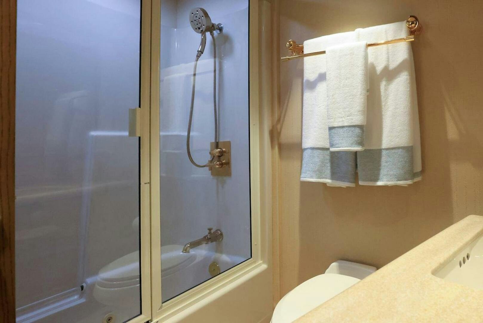 a bathroom with a shower and a toilet aboard NORTH COAST Yacht for Sale