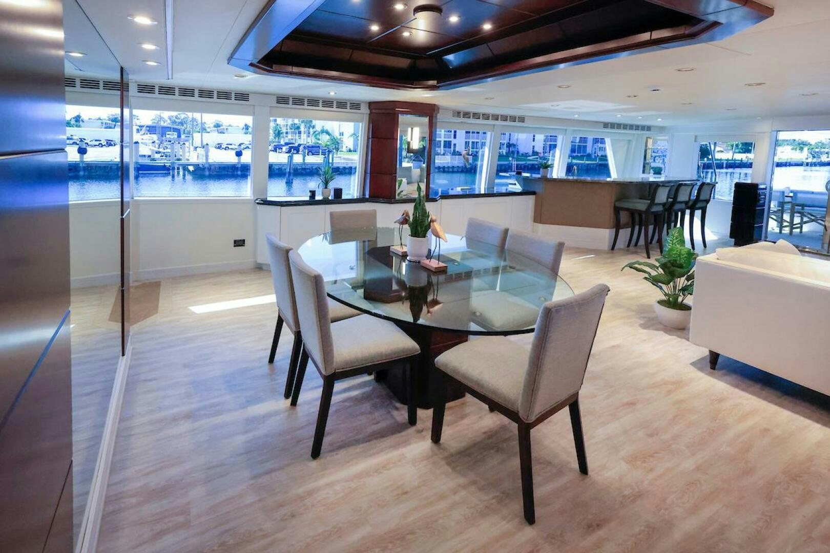 a room with a table and chairs aboard NORTH COAST Yacht for Sale