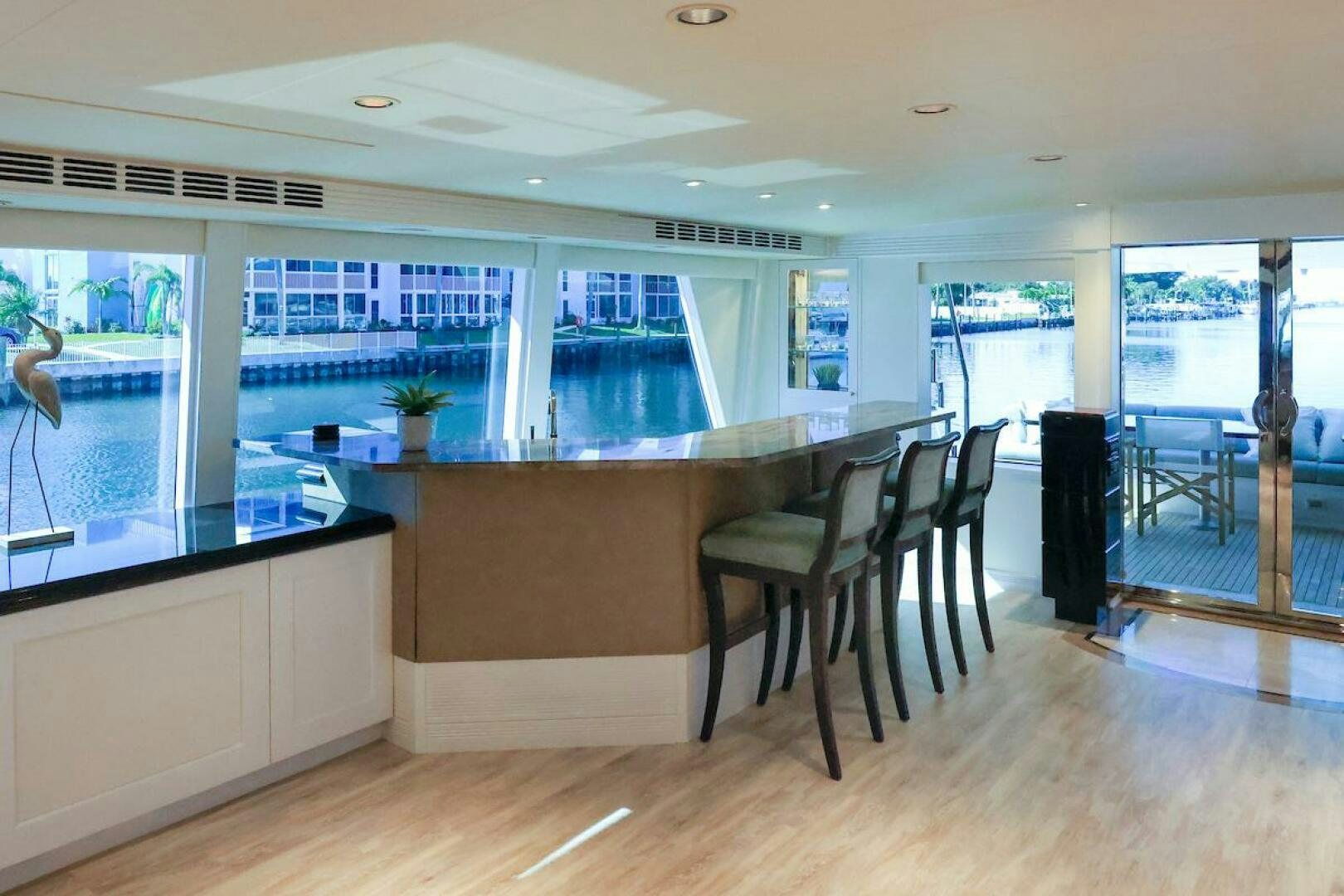 a large kitchen with a table and chairs aboard NORTH COAST Yacht for Sale