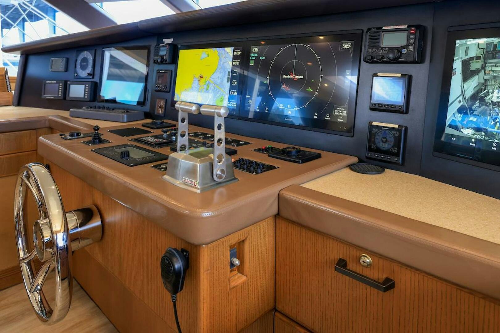a desk with multiple monitors and a computer on it aboard NORTH COAST Yacht for Sale