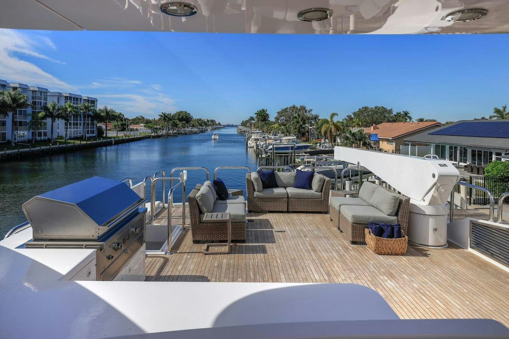 a deck with a pool and a deck with chairs and a table aboard NORTH COAST Yacht for Sale