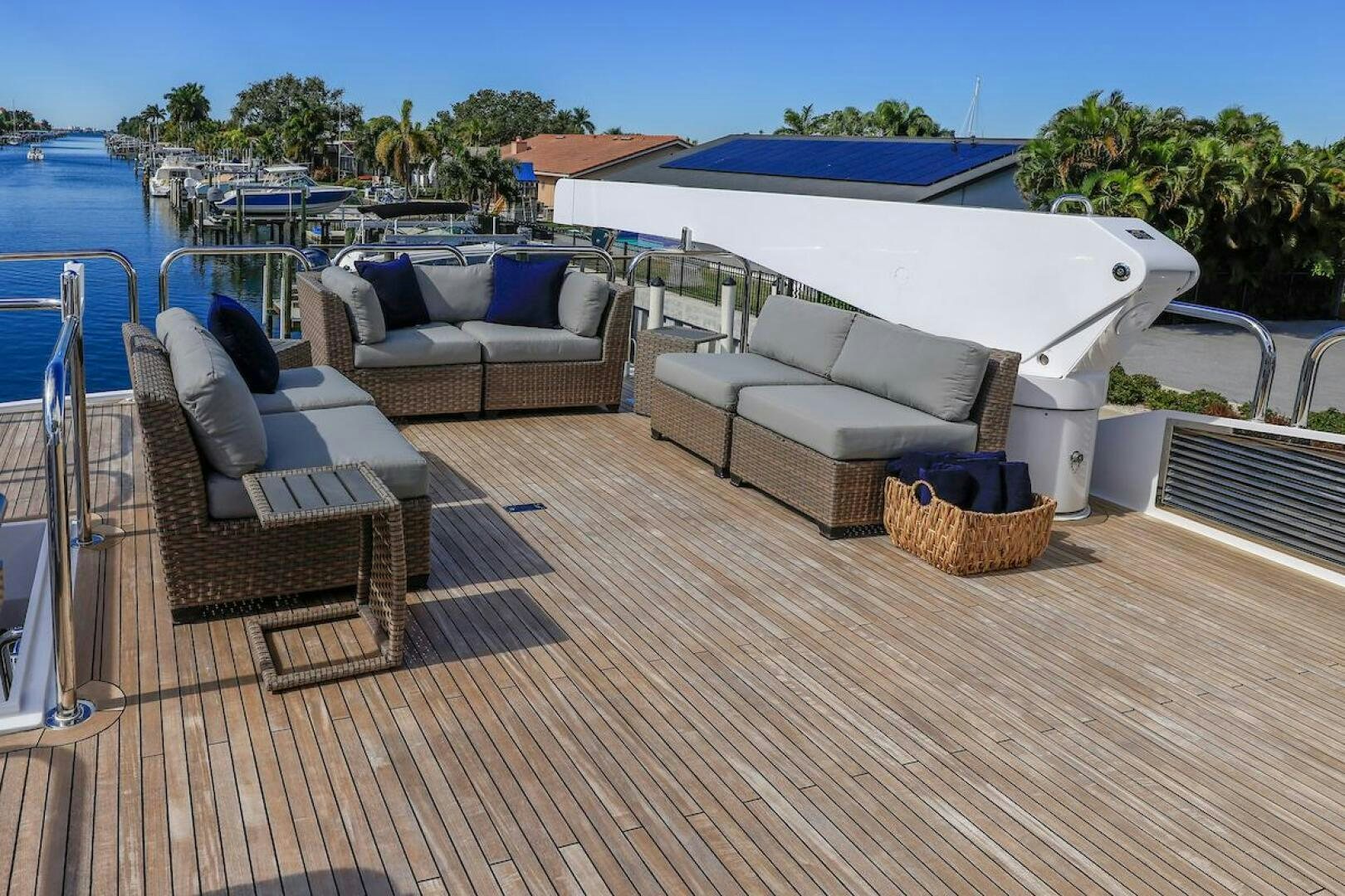 a deck with couches and a pool aboard NORTH COAST Yacht for Sale