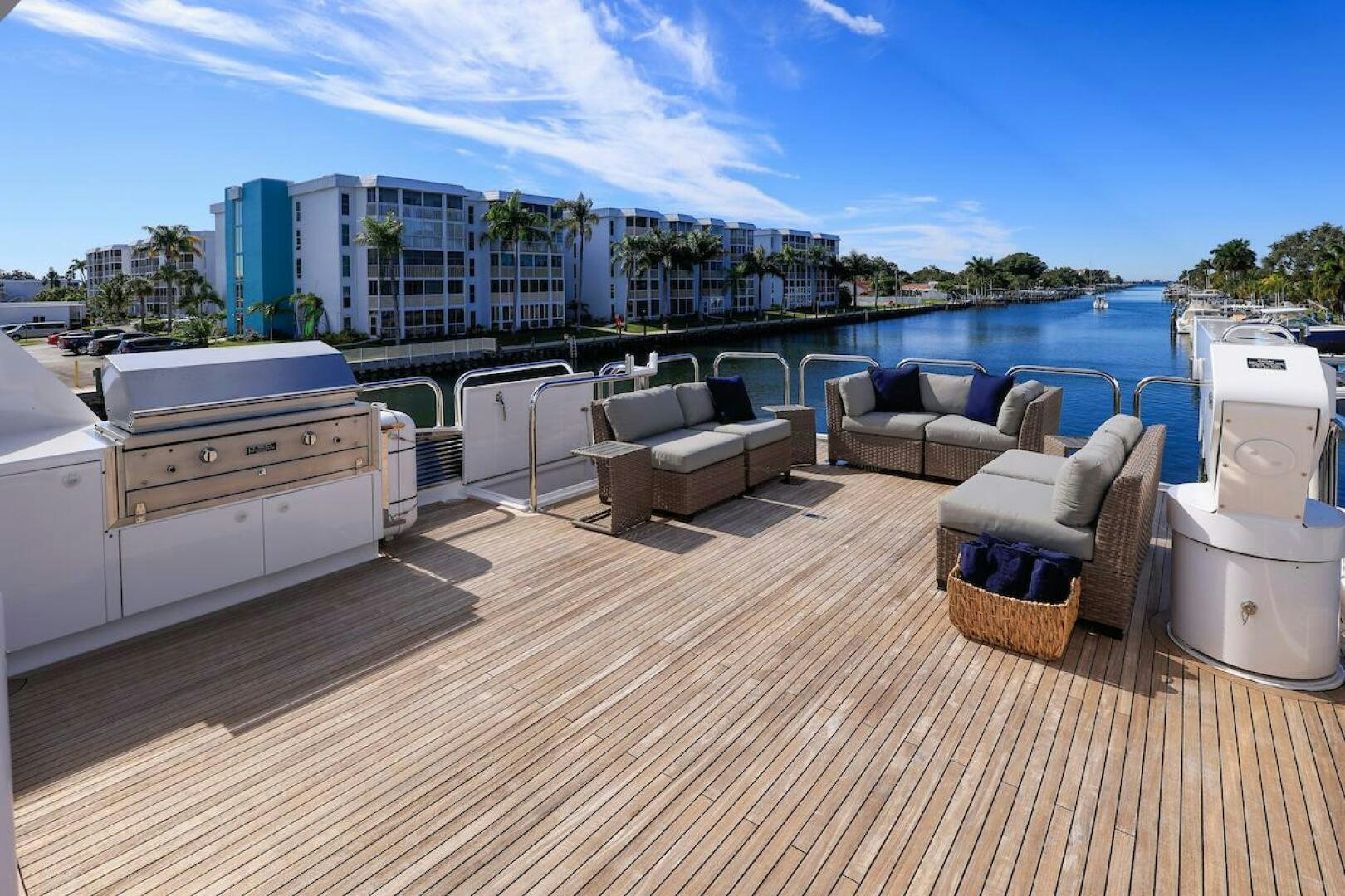 a deck with a view of a city and a body of water aboard NORTH COAST Yacht for Sale