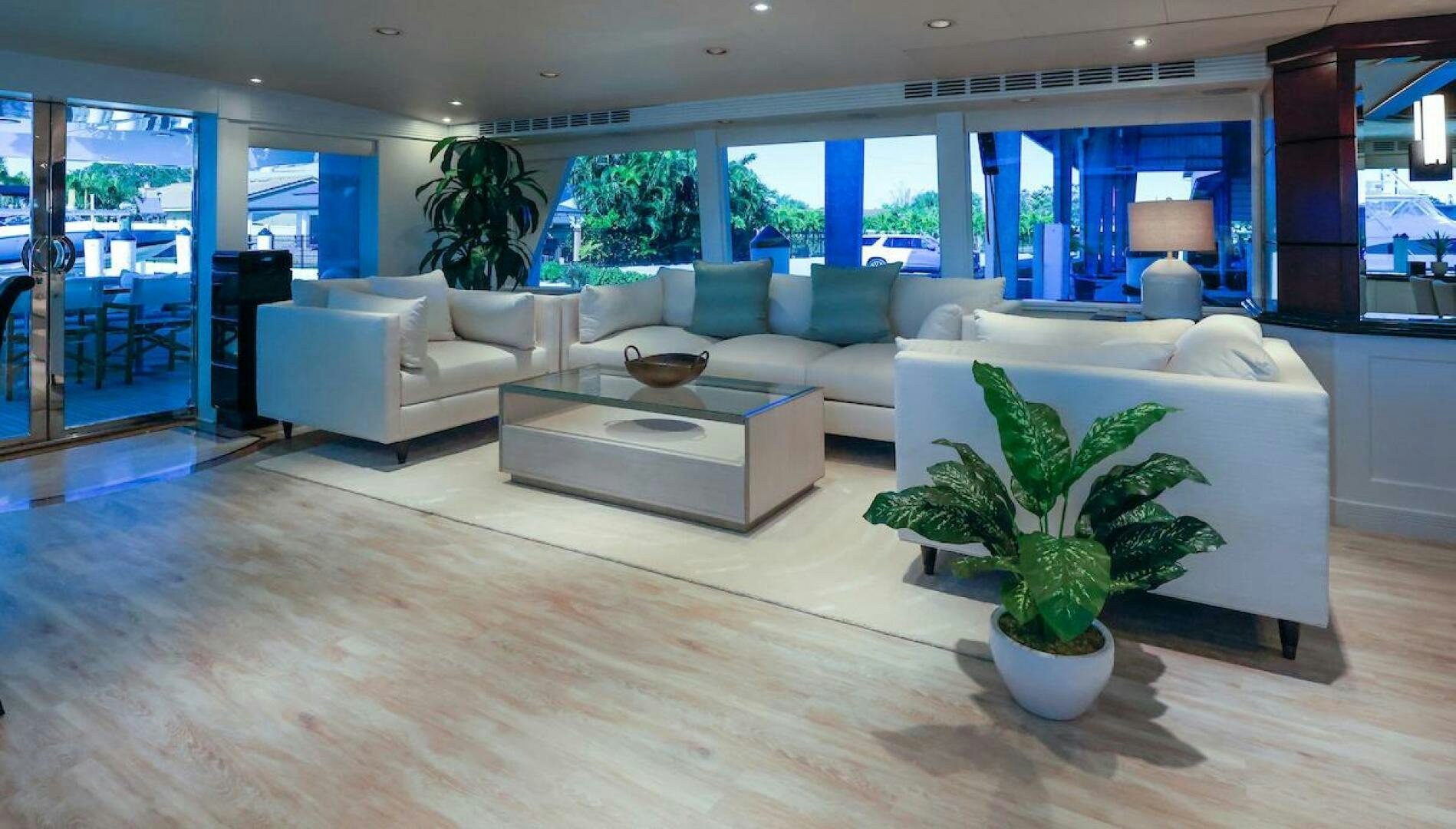 a living room with a large window aboard NORTH COAST Yacht for Sale