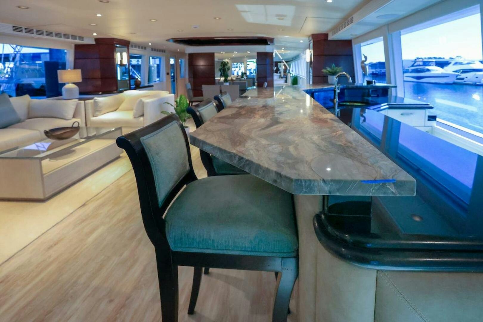 a room with a table and chairs aboard NORTH COAST Yacht for Sale
